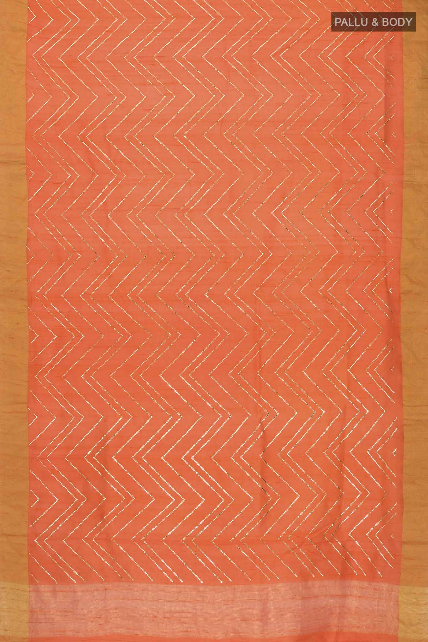 Flat view of Orange Raw Silk Saree with Embroidery on the body and Zari Border