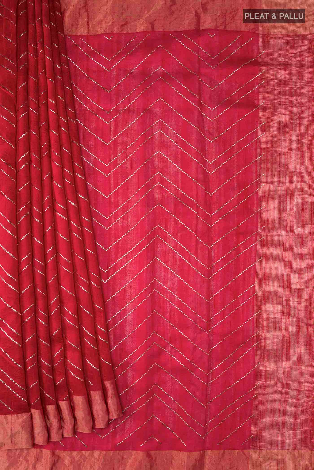 Pleats and pallu of Red Raw Silk Saree with Embroidery on the body and Zari Border