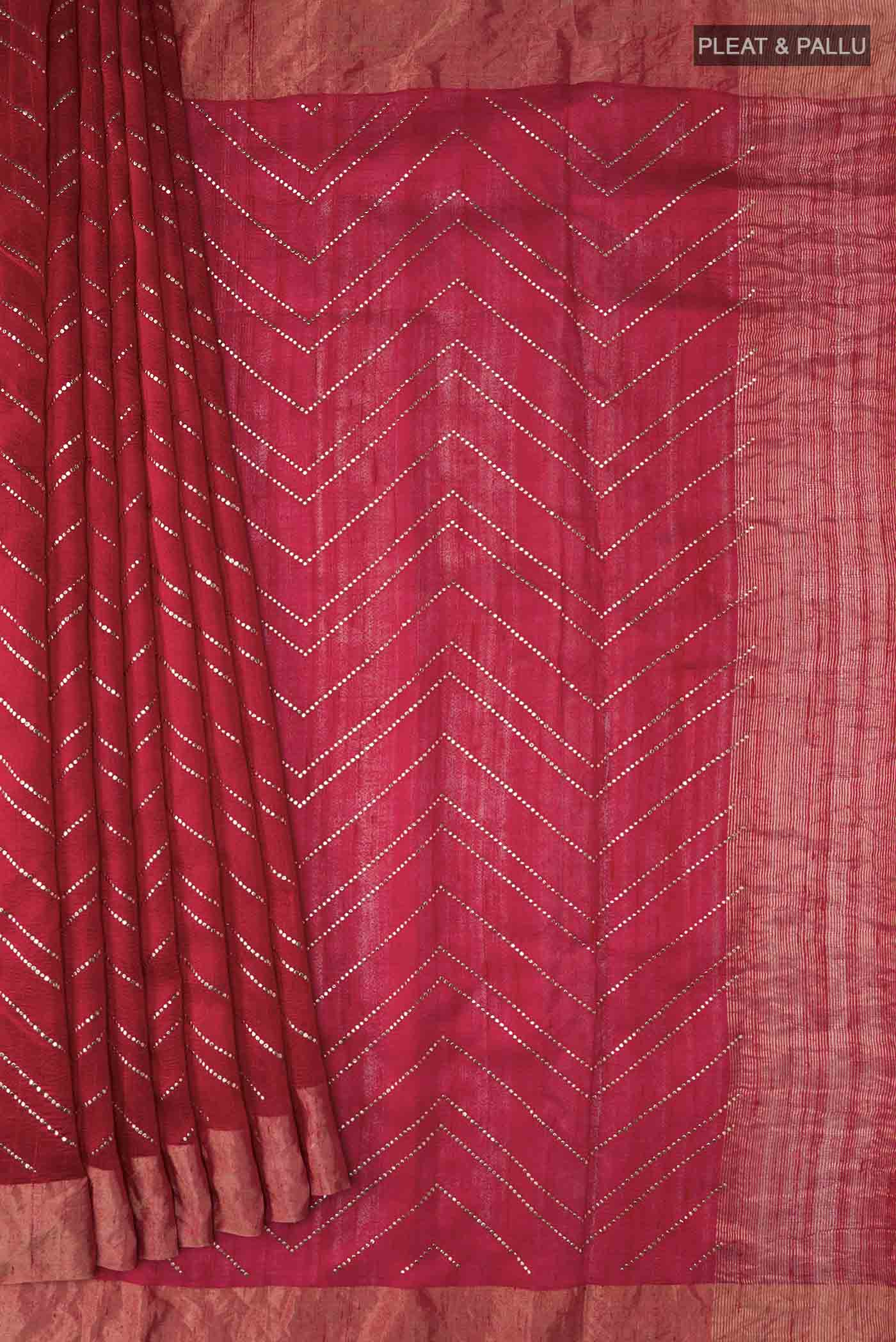 Pleats and pallu of Red Raw Silk Saree with Embroidery on the body and Zari Border