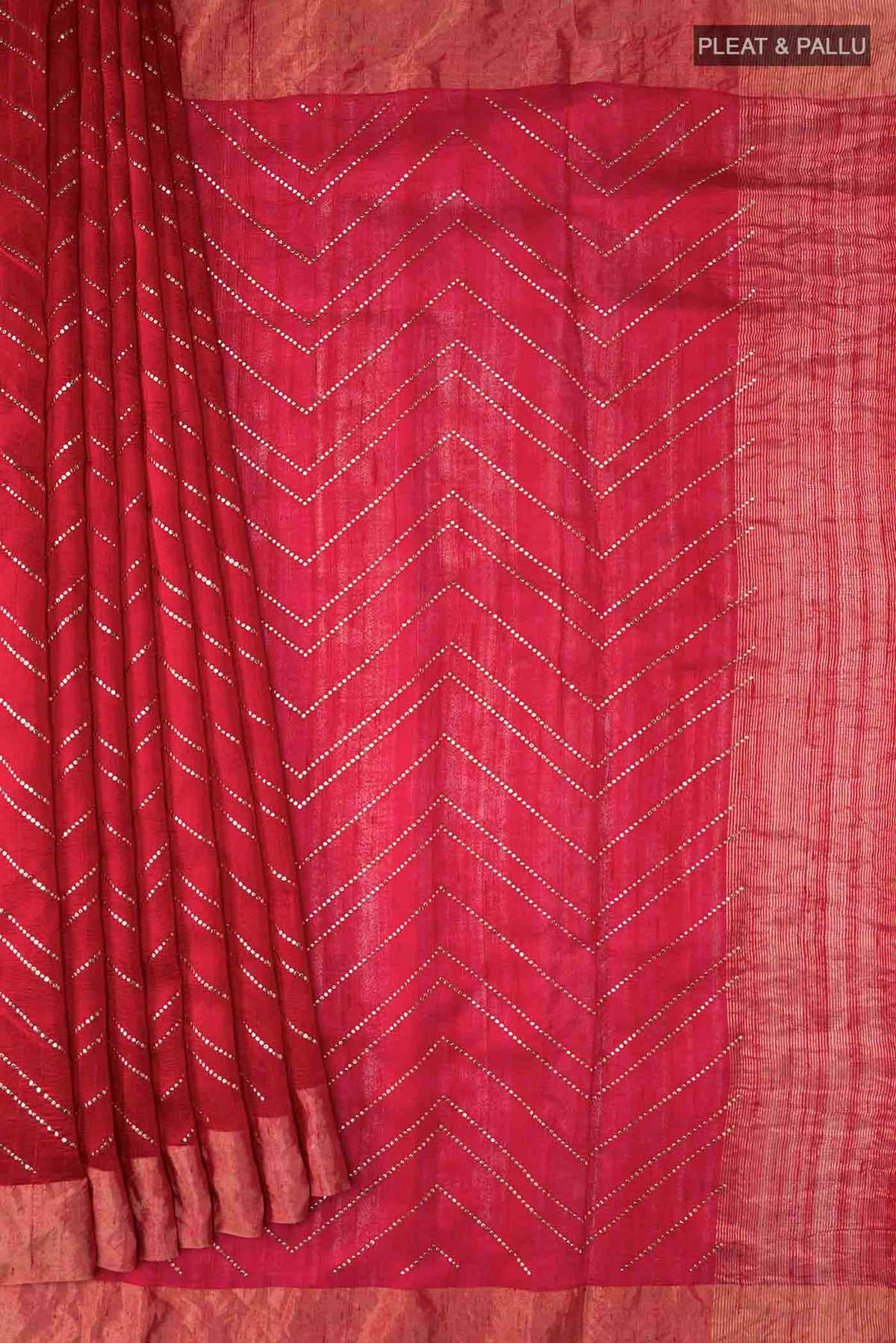 Pleats and pallu of Red Raw Silk Saree with Embroidery on the body and Zari Border