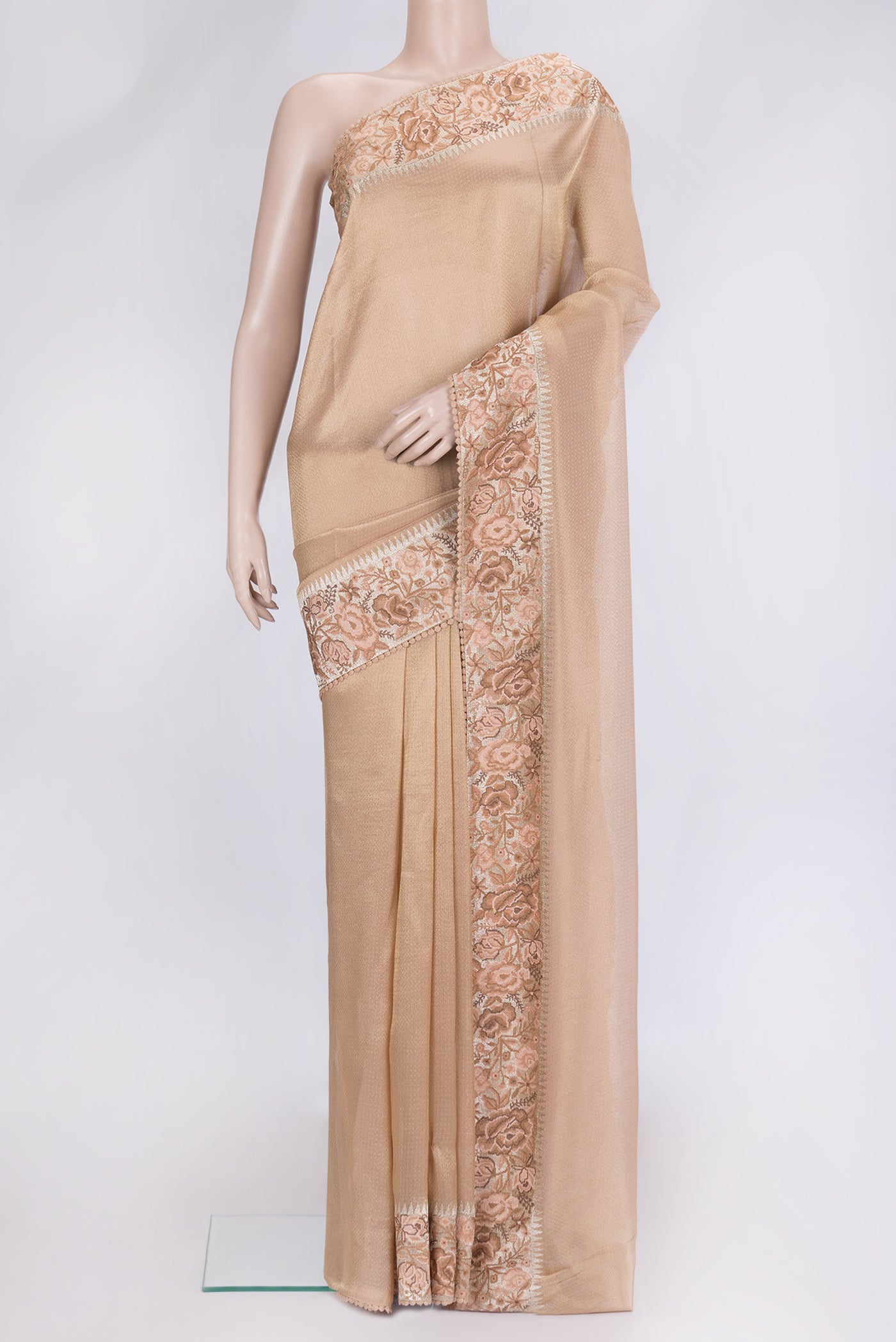 Golden Peach Dual Tone Organza Silk Saree with Zari Brocade on the body and Fancy Border.  displayed on a mannequin