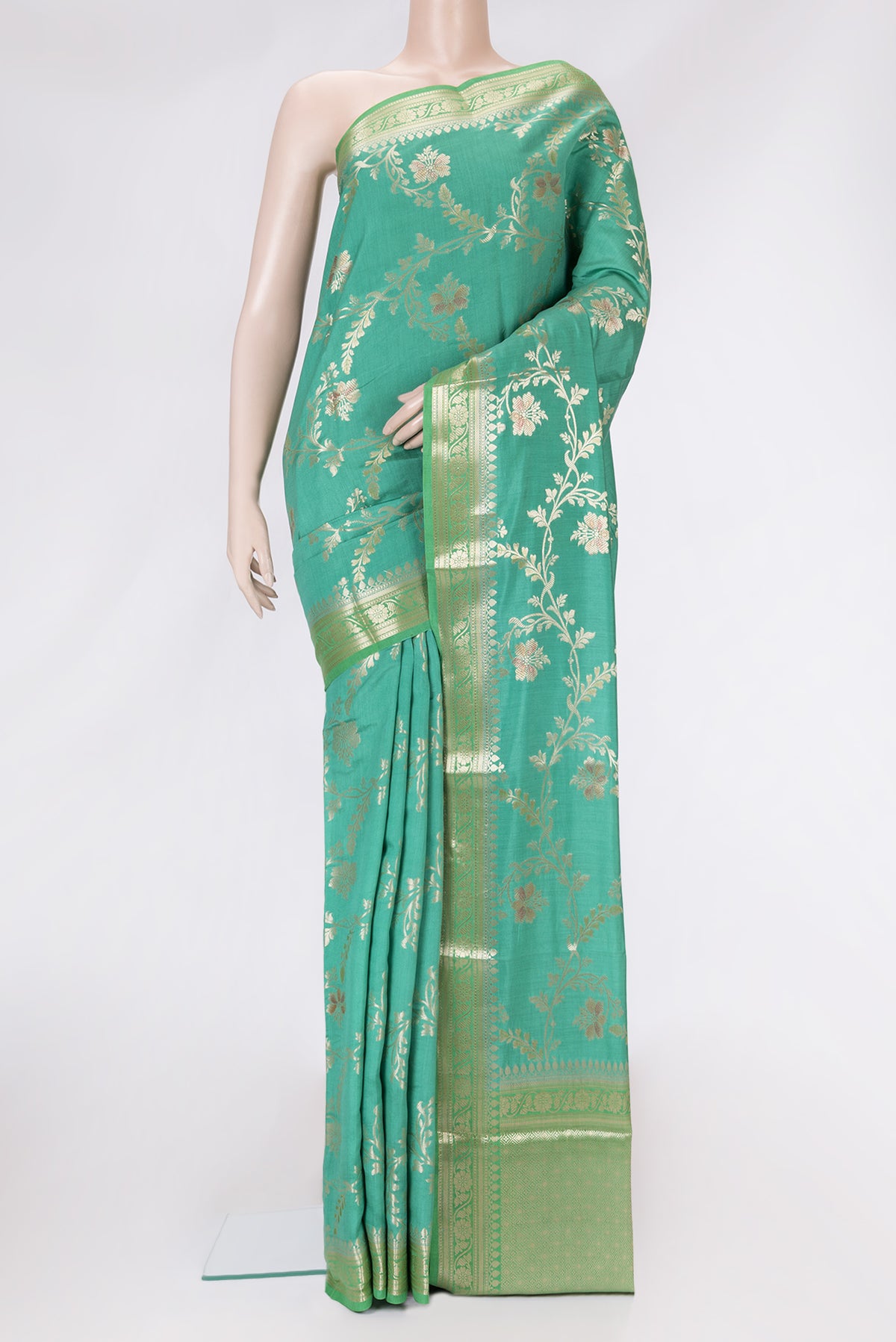 Sea Green Dual Tone Tussar Silk Saree with Zari Brocade on the body and Zari Border.  displayed on a mannequin