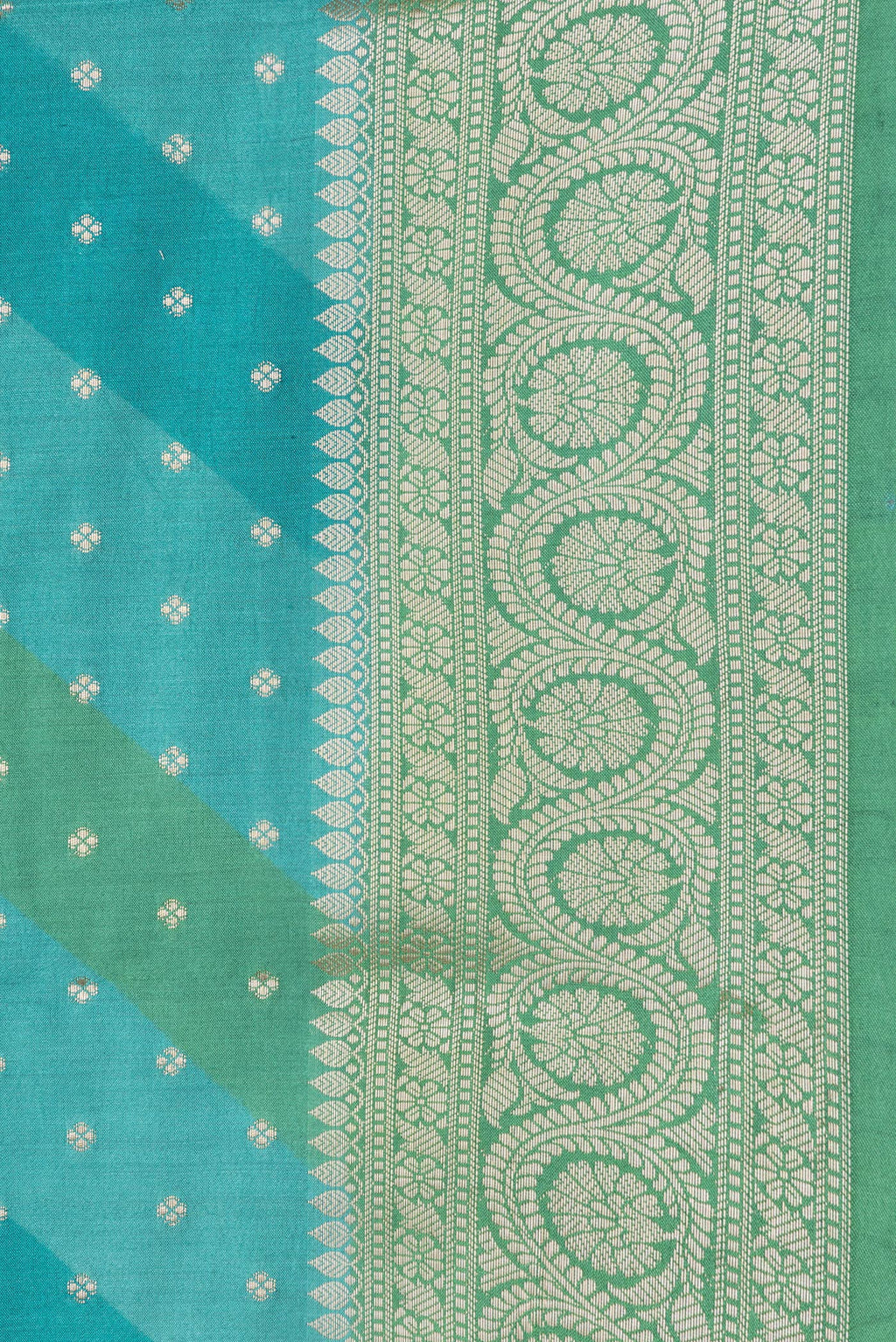 Border image of Sky Blue Dual Tone Tussar Silk Saree with Zari Butta on the body and Zari Border. 
