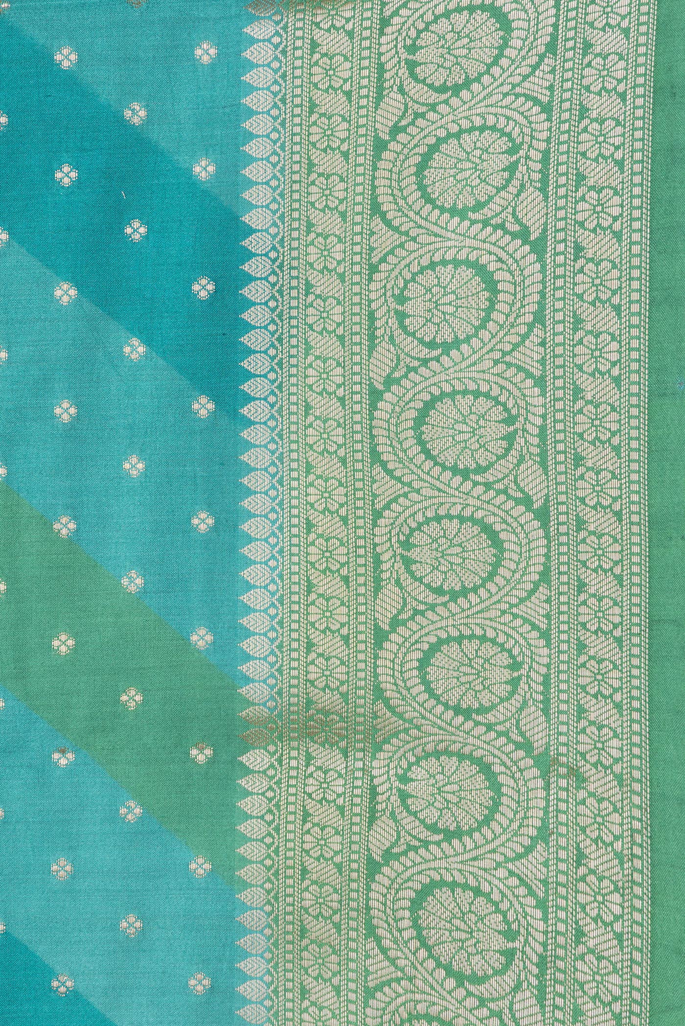 Border image of Sky Blue Dual Tone Tussar Silk Saree with Zari Butta on the body and Zari Border. 