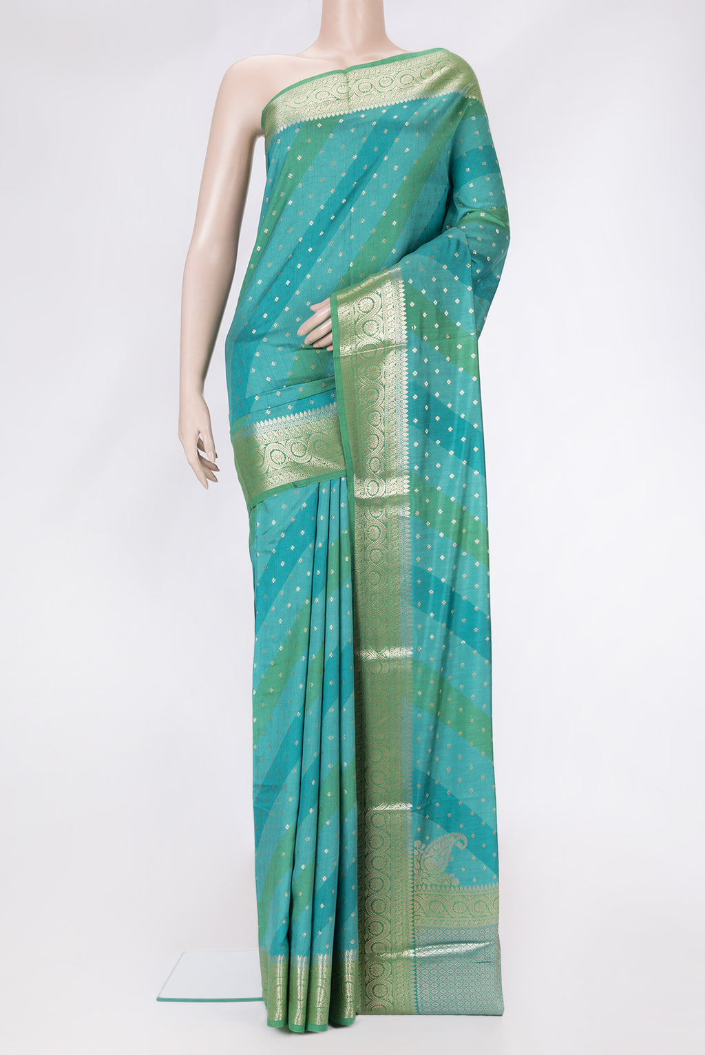 Sky Blue Dual Tone Tussar Silk Saree with Zari Butta on the body and Zari Border.  displayed on a mannequin