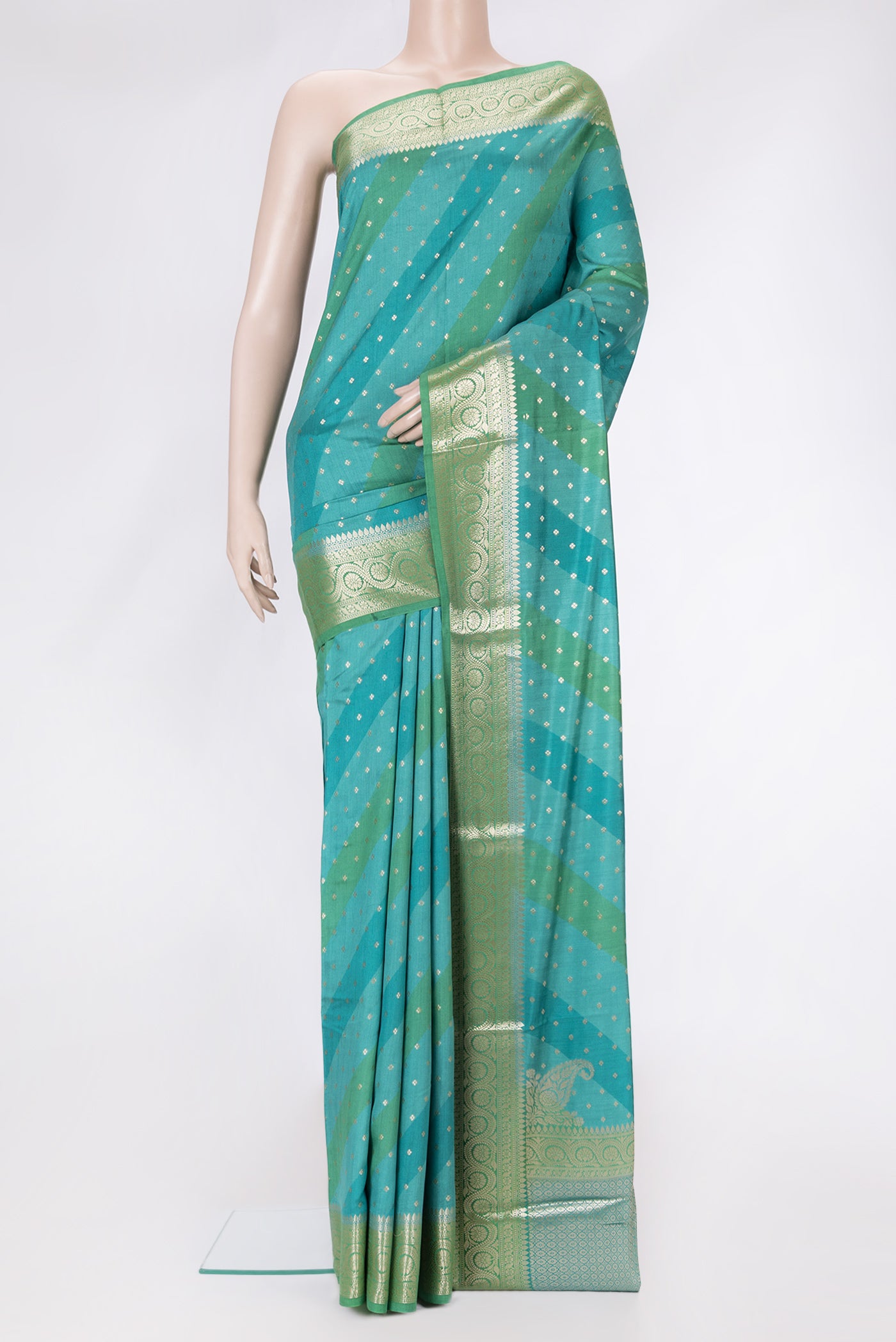 Sky Blue Dual Tone Tussar Silk Saree with Zari Butta on the body and Zari Border.  displayed on a mannequin