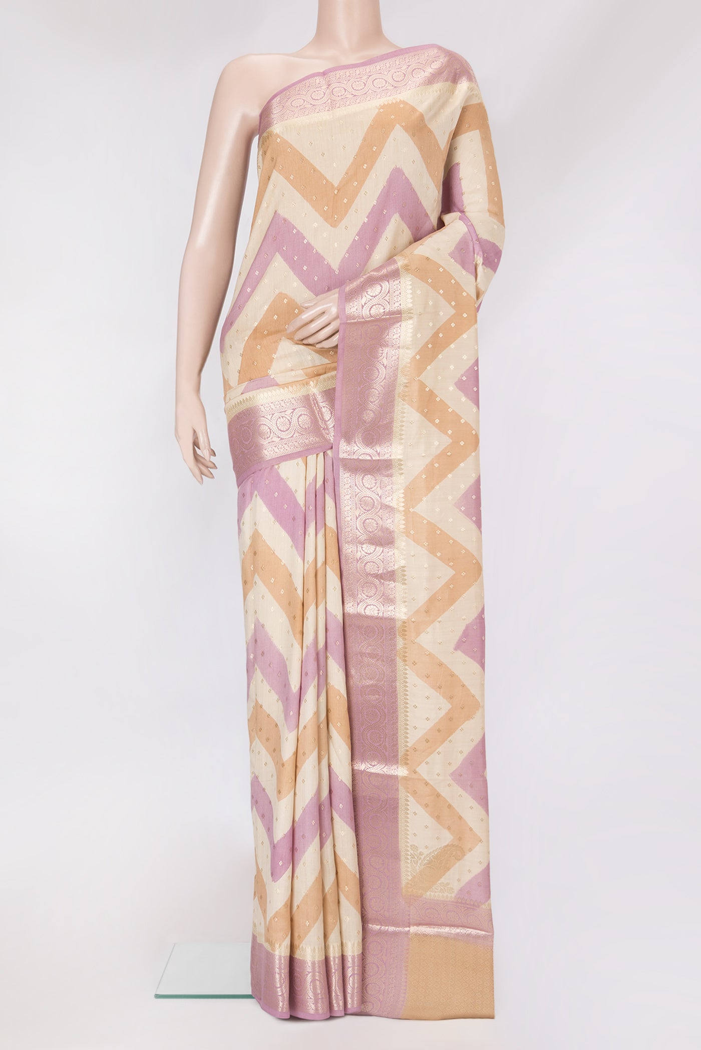 Beige Dual Tone Tussar Silk Saree with Zari Butta on the body and Zari Border.  displayed on a mannequin