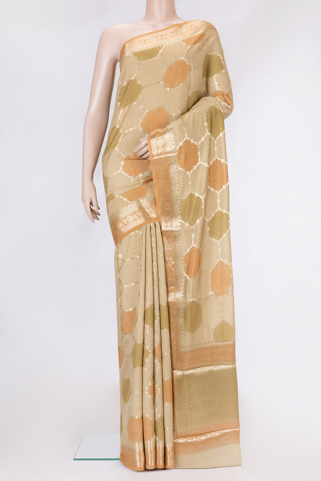 Beige Dual Tone Tussar Silk Saree with Zari Brocade on the body and Zari Border.  displayed on a mannequin
