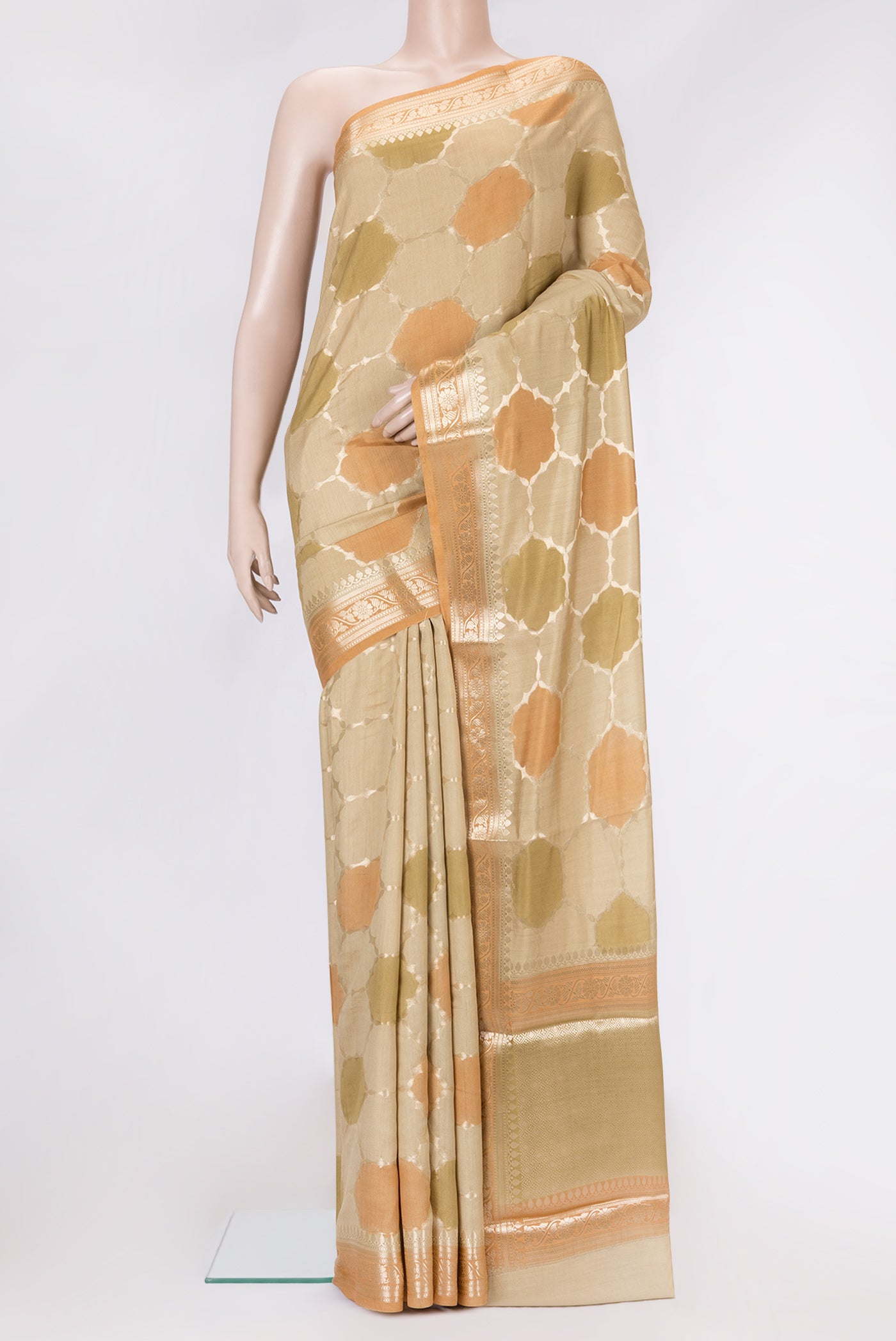Beige Dual Tone Tussar Silk Saree with Zari Brocade on the body and Zari Border.  displayed on a mannequin