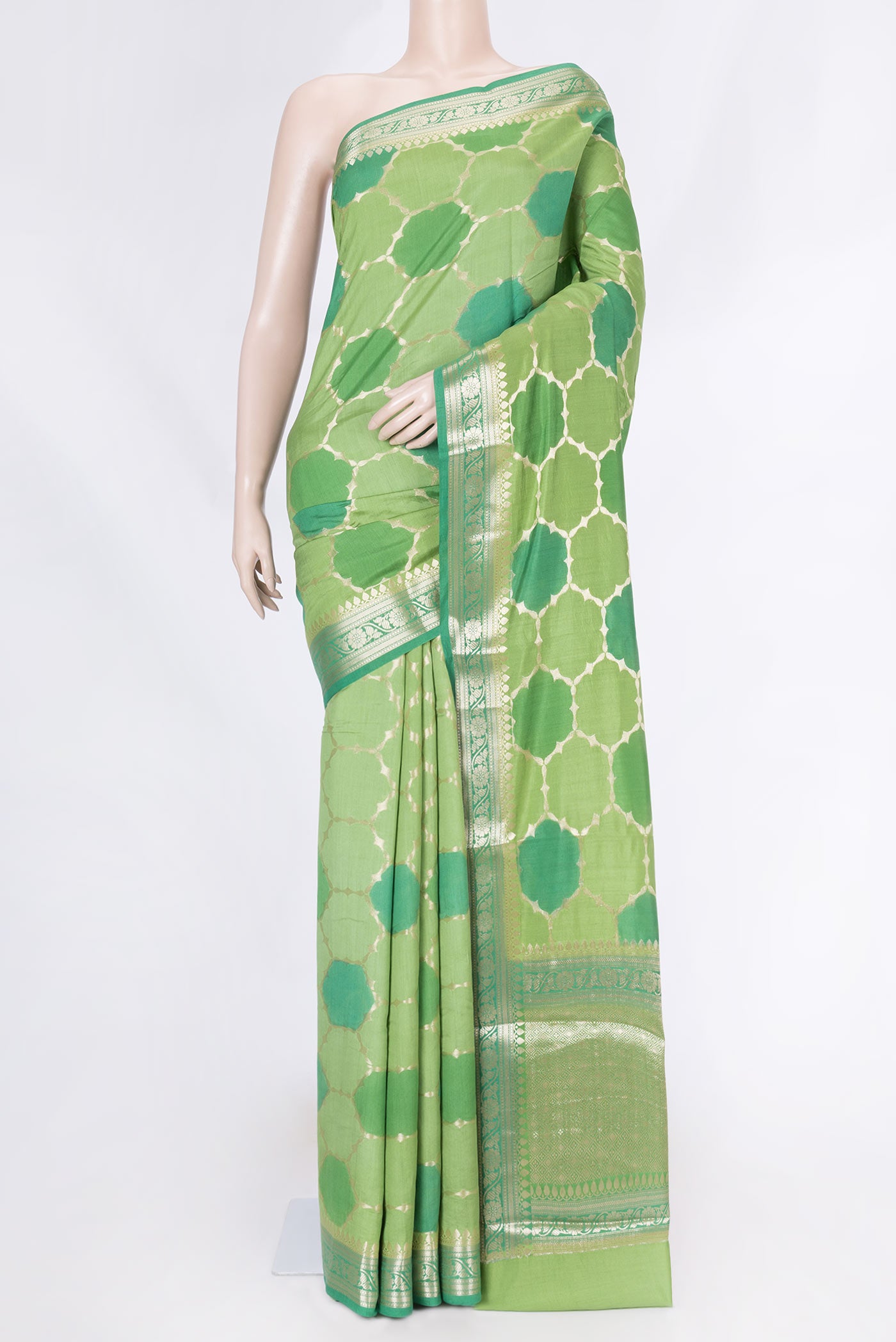 Green Banarasi Raw Silk Saree with Zari Brocade on the body and Zari Border displayed on a mannequin