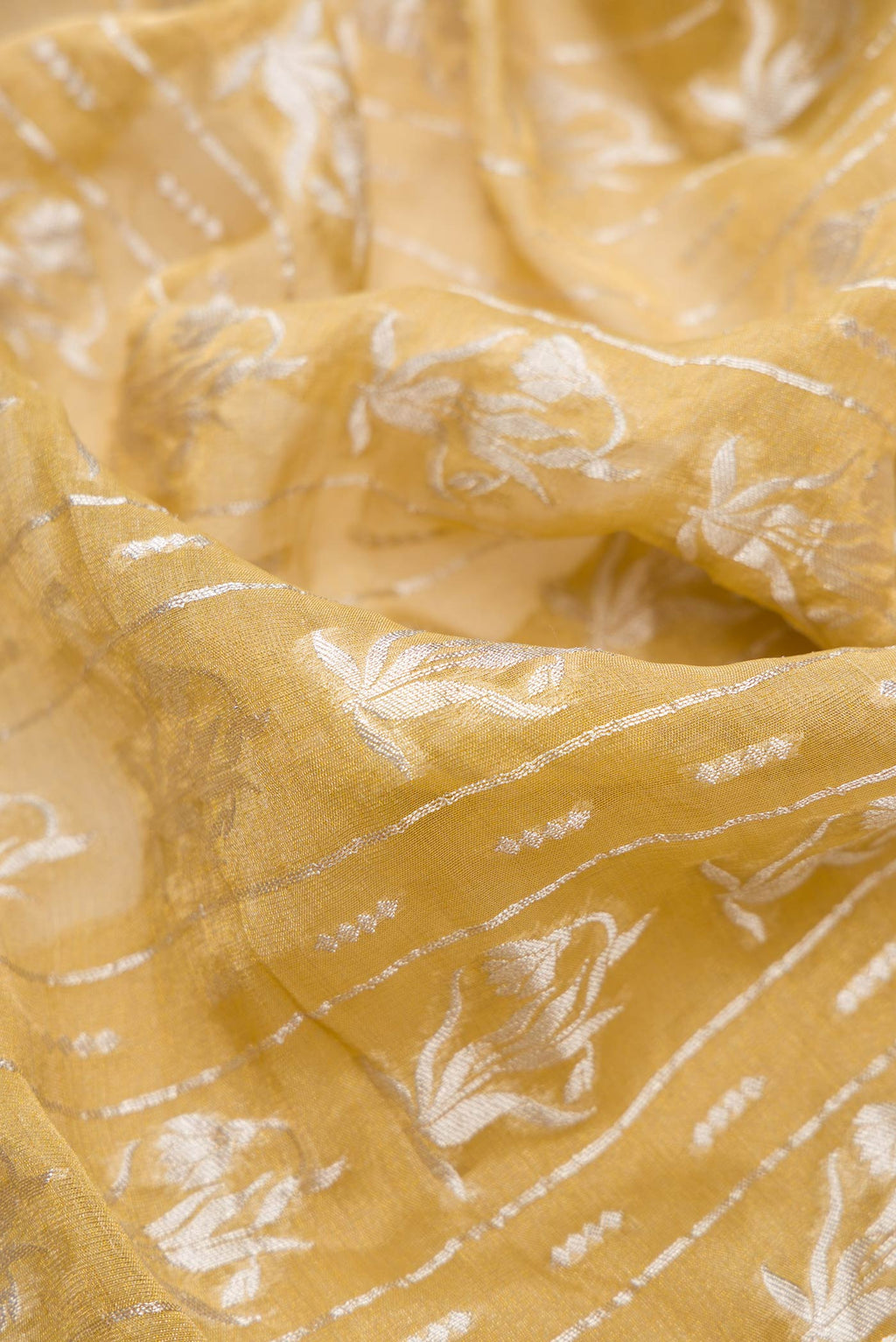 Close up of Mehandi Green Dual Tone Banarasi Georgette Saree with Zari Brocade on the body and Zari Border.  displaying folds