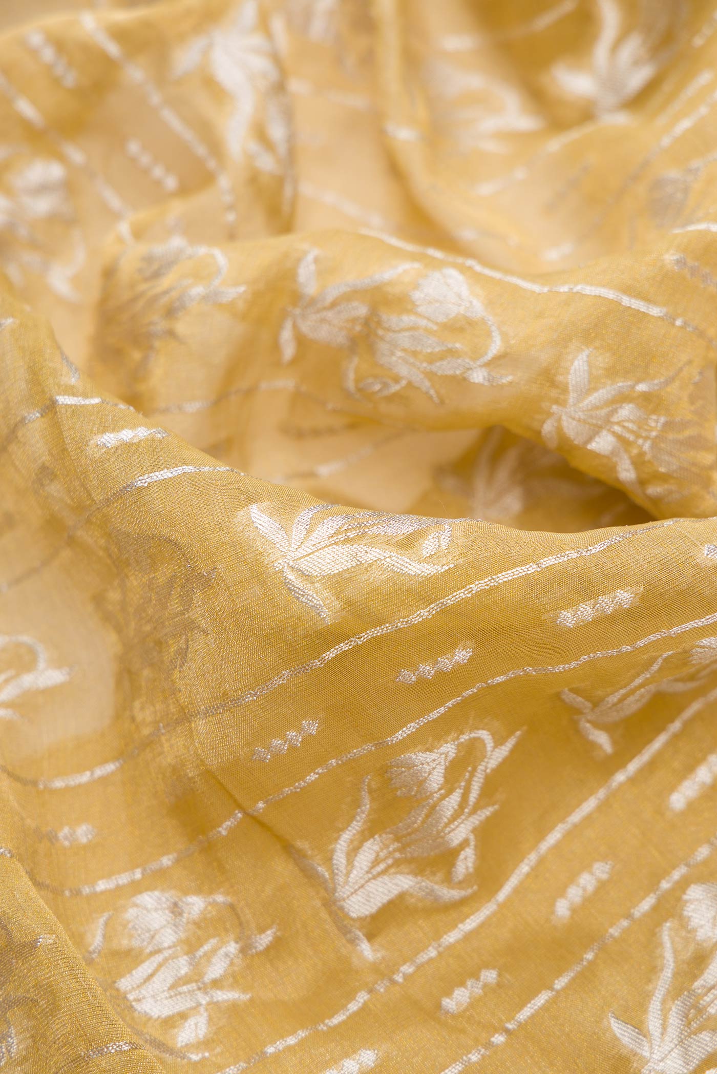 Close up of Mehandi Green Dual Tone Banarasi Georgette Saree with Zari Brocade on the body and Zari Border.  displaying folds