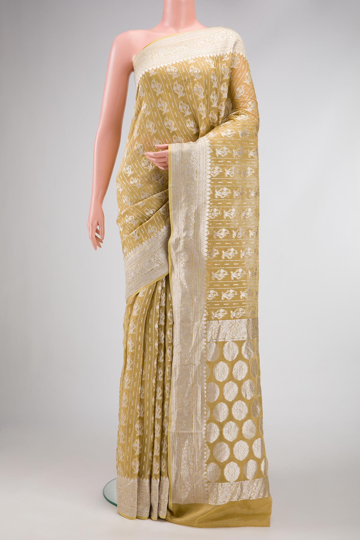 Mehandi Green Dual Tone Banarasi Georgette Saree with Zari Brocade on the body and Zari Border.  displayed on a mannequin