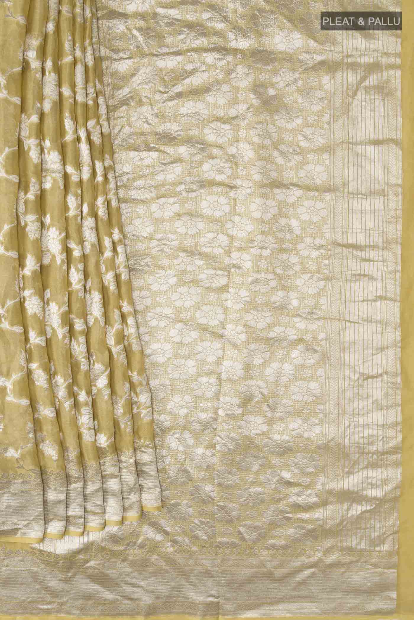 Pleats and pallu of Beige Banarasi Georgette Saree with Zari Butta on the body and Zari Border