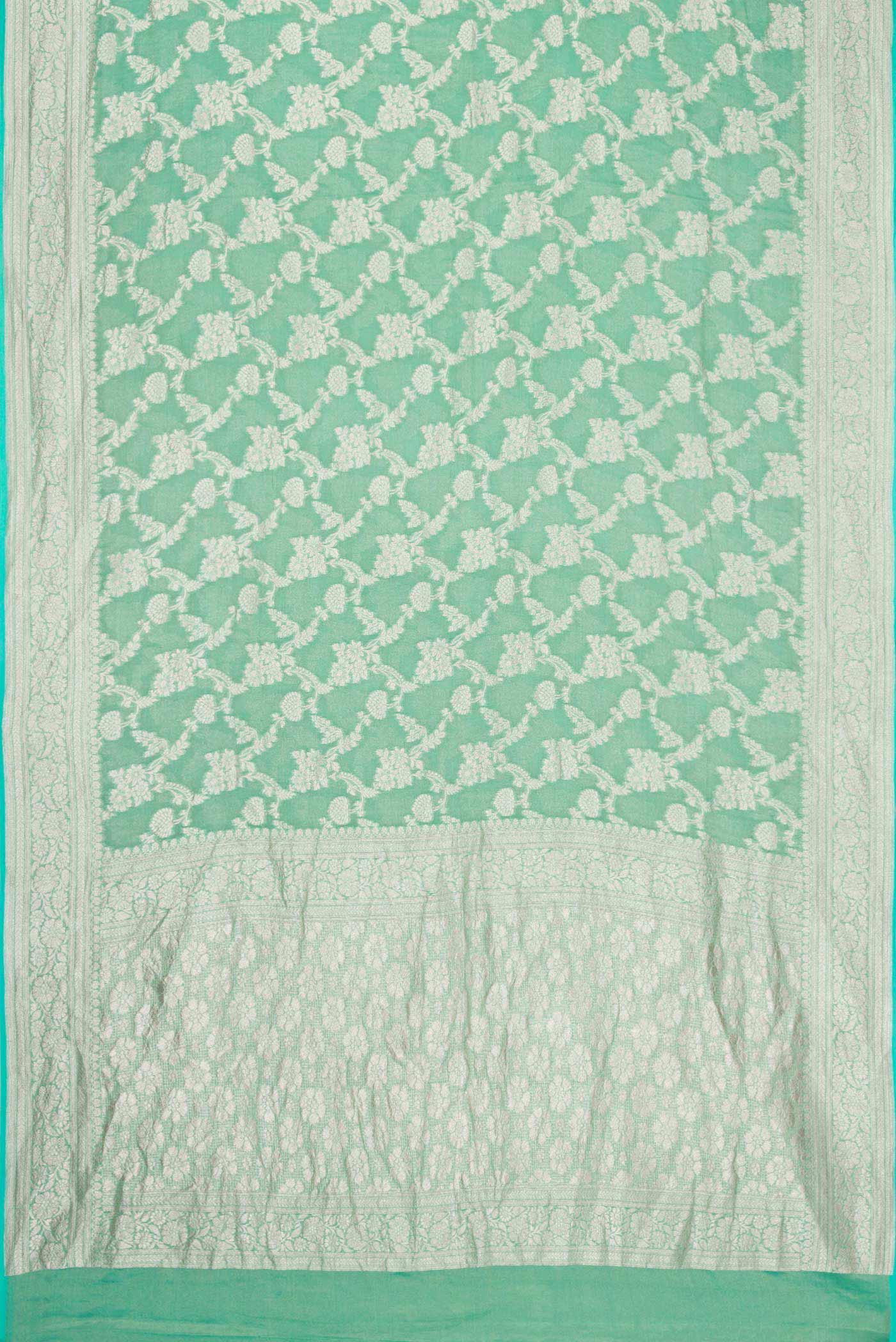 Flat view of Green Dual Tone Banarasi Georgette Saree with Zari Brocade on the body and Zari Border. 