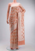Peach Banarasi Georgette Saree with Zari Butta on the body and Zari Border displayed on a mannequin
