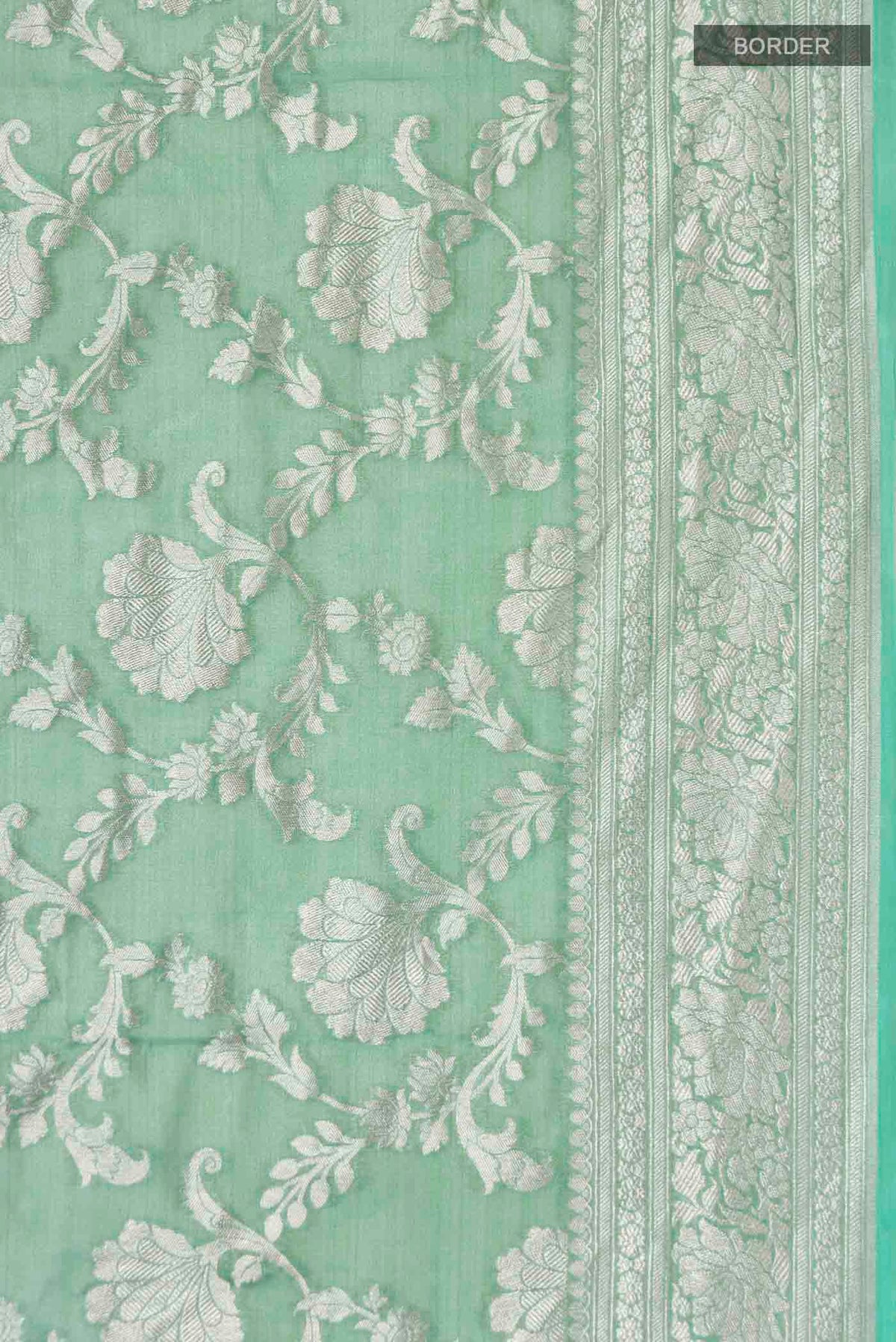 Border image of Green Banarasi Georgette Saree with Zari Butta on the body and Zari Border