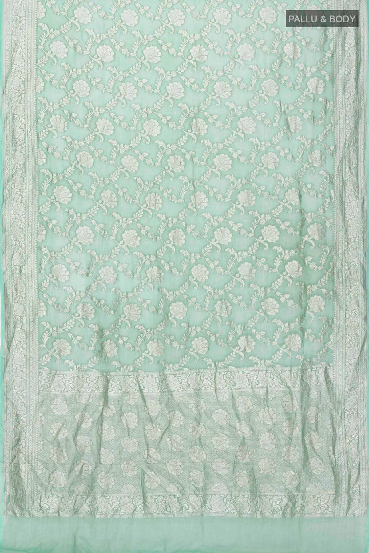Flat view of Green Banarasi Georgette Saree with Zari Butta on the body and Zari Border