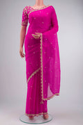 Pink Organza Silk Saree with Embroidery on the body and Embroidery Border displayed on a mannequin