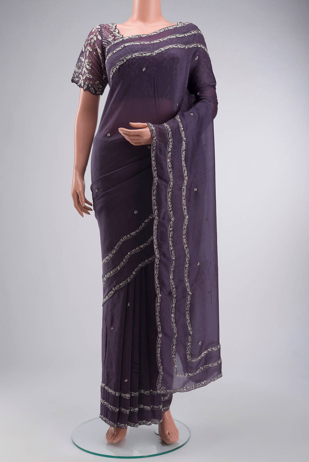 Lilac Satin Silk Saree with Plain Body and Embroidery Border displayed on a mannequin
