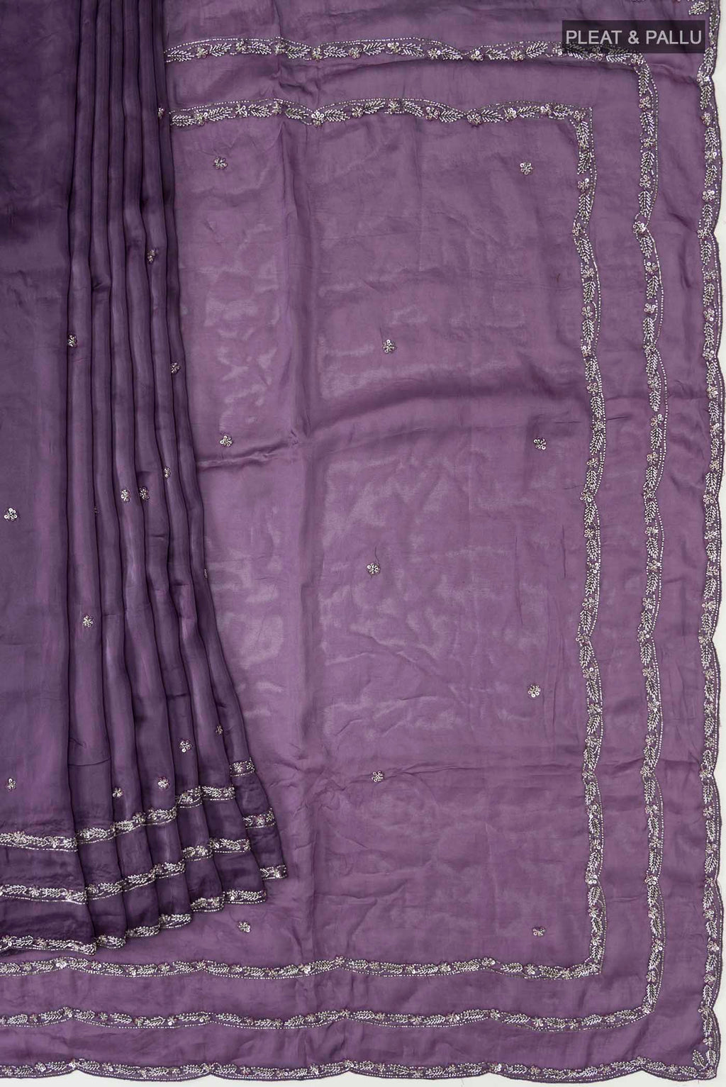 Pleats and pallu of Lilac Satin Silk Saree with Plain Body and Embroidery Border