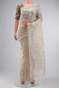 Off White Organza Silk Saree with Embroidery on the body and Embroidery Border displayed on a mannequin