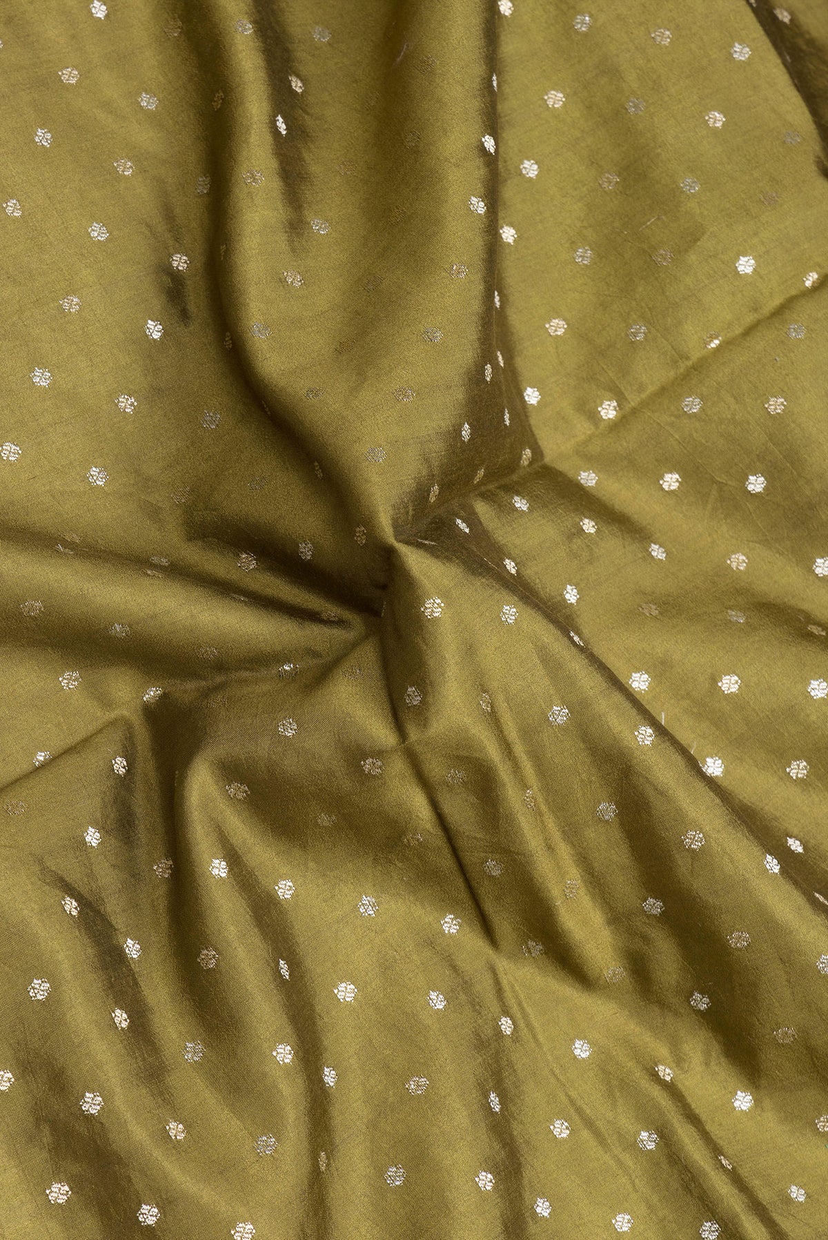 Close up of Mehandi Green Dual Tone Tussar Silk Saree with Zari Butta on the body and Fancy Border.  displaying folds