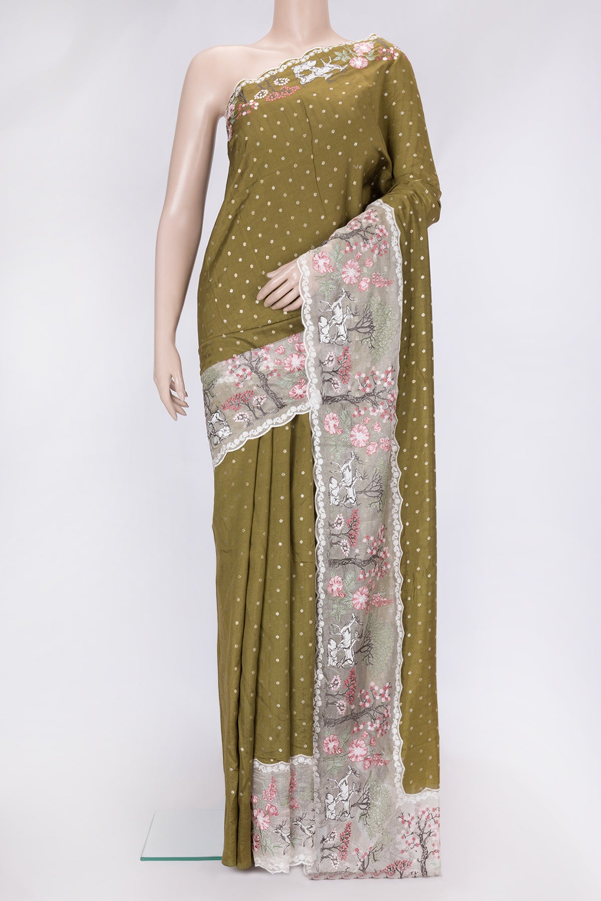Mehandi Green Dual Tone Tussar Silk Saree with Zari Butta on the body and Fancy Border.  displayed on a mannequin