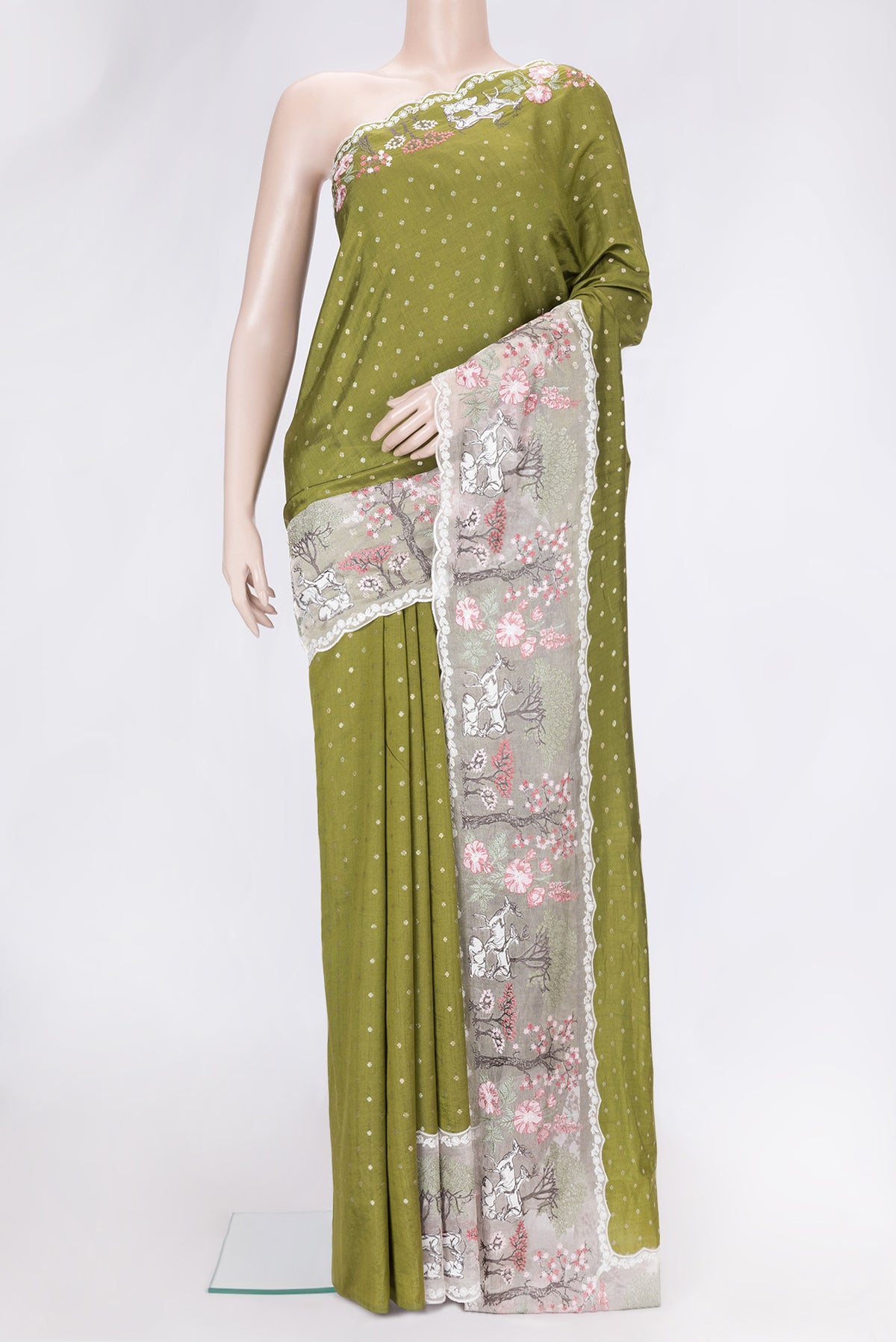 Mehandi Green Dual Tone Tussar Silk Saree with Zari Butta on the body and Embroidery Border.  displayed on a mannequin