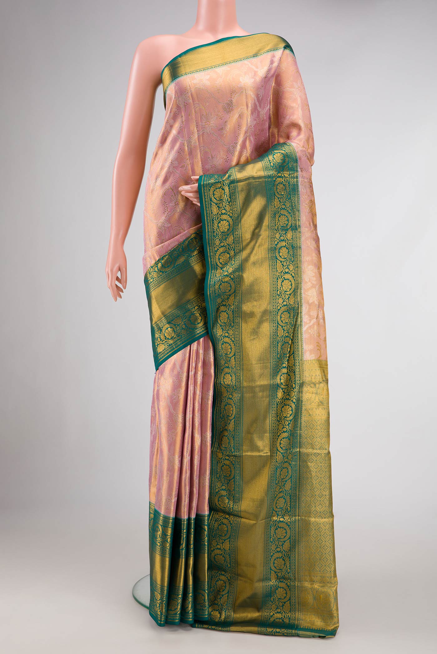 Rose Gold Dual Tone Kanchipuram Tissue Silk Saree with Zari Brocade on the body and Zari Border.  displayed on a mannequin