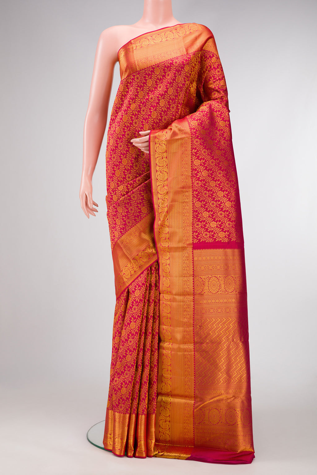 Pink Dual Tone Kanjivaram Silk Saree with Zari Brocade on the body and Zari Border.  displayed on a mannequin