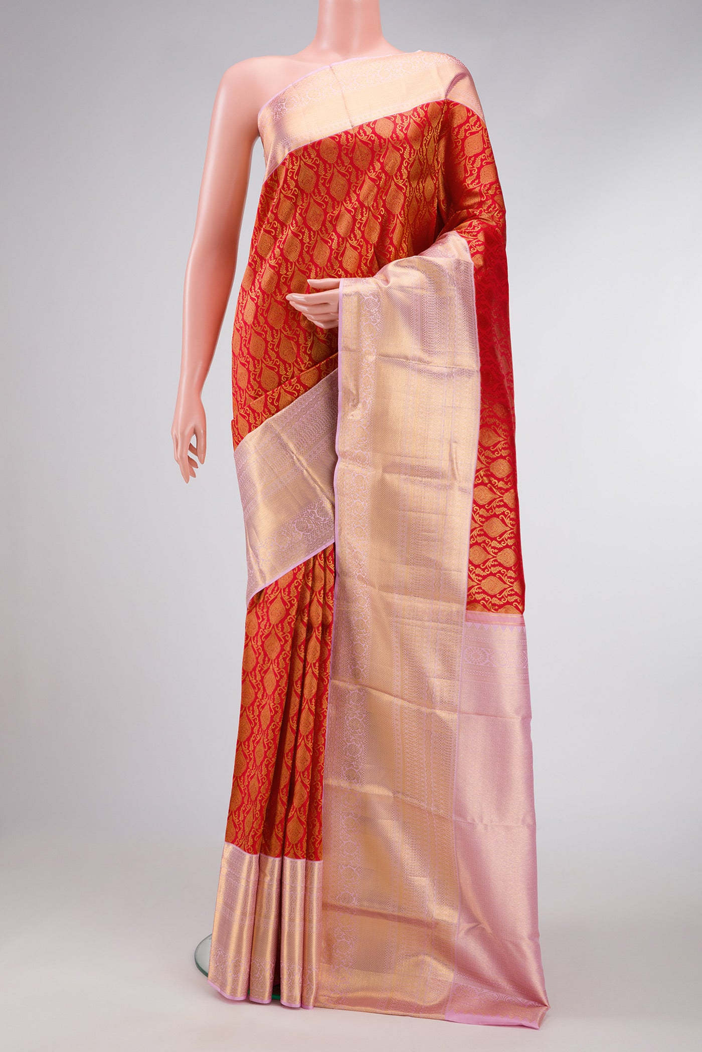Red Dual Tone Kanchipuram Silk Saree with Zari Brocade on the body and Zari Border.  displayed on a mannequin