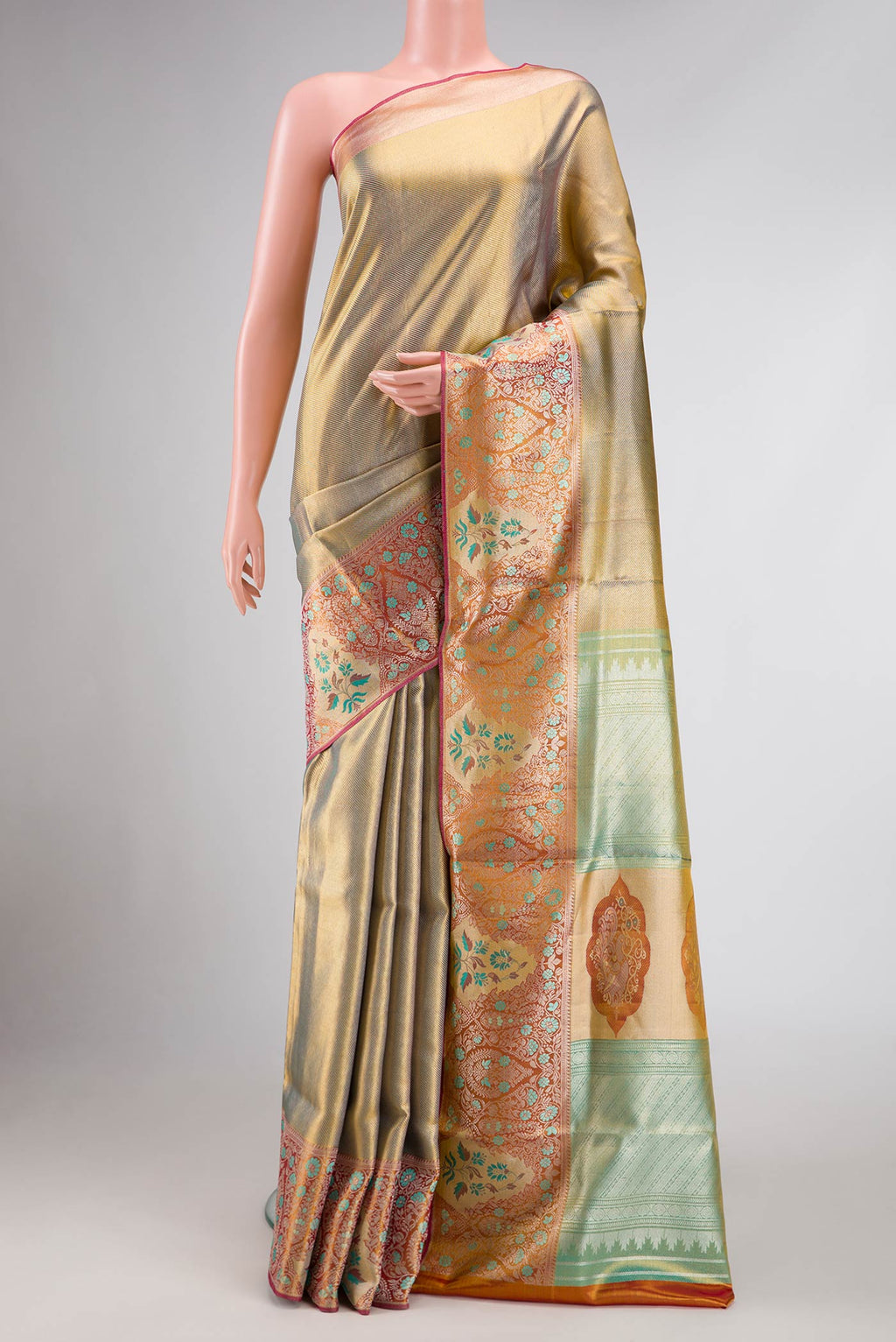 Green Dual Tone Kanchipuram Tissue Silk Saree with Zari Brocade on the body and Zari Border.  displayed on a mannequin