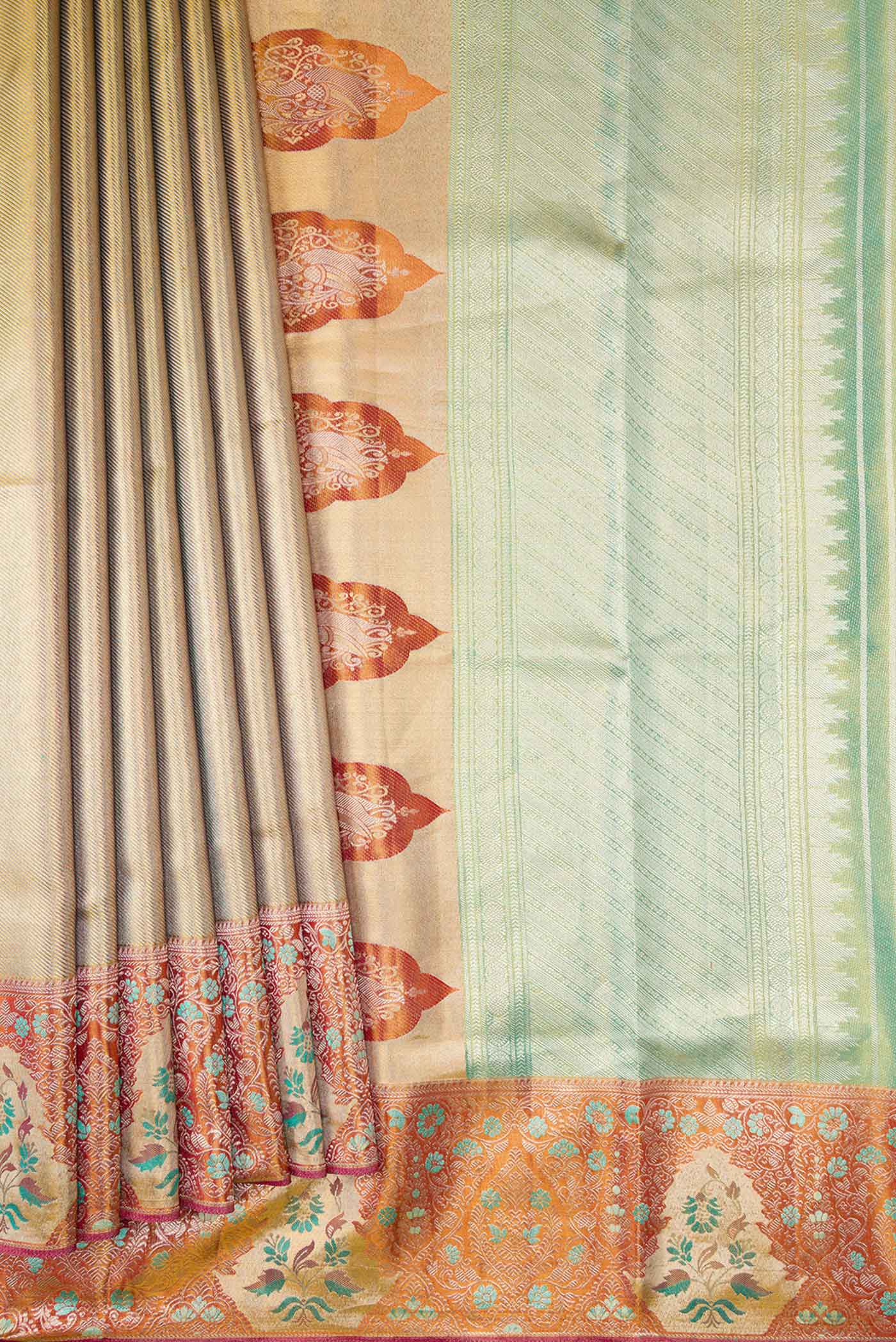 Pleats and pallu of Green Dual Tone Kanchipuram Tissue Silk Saree with Zari Brocade on the body and Zari Border. 