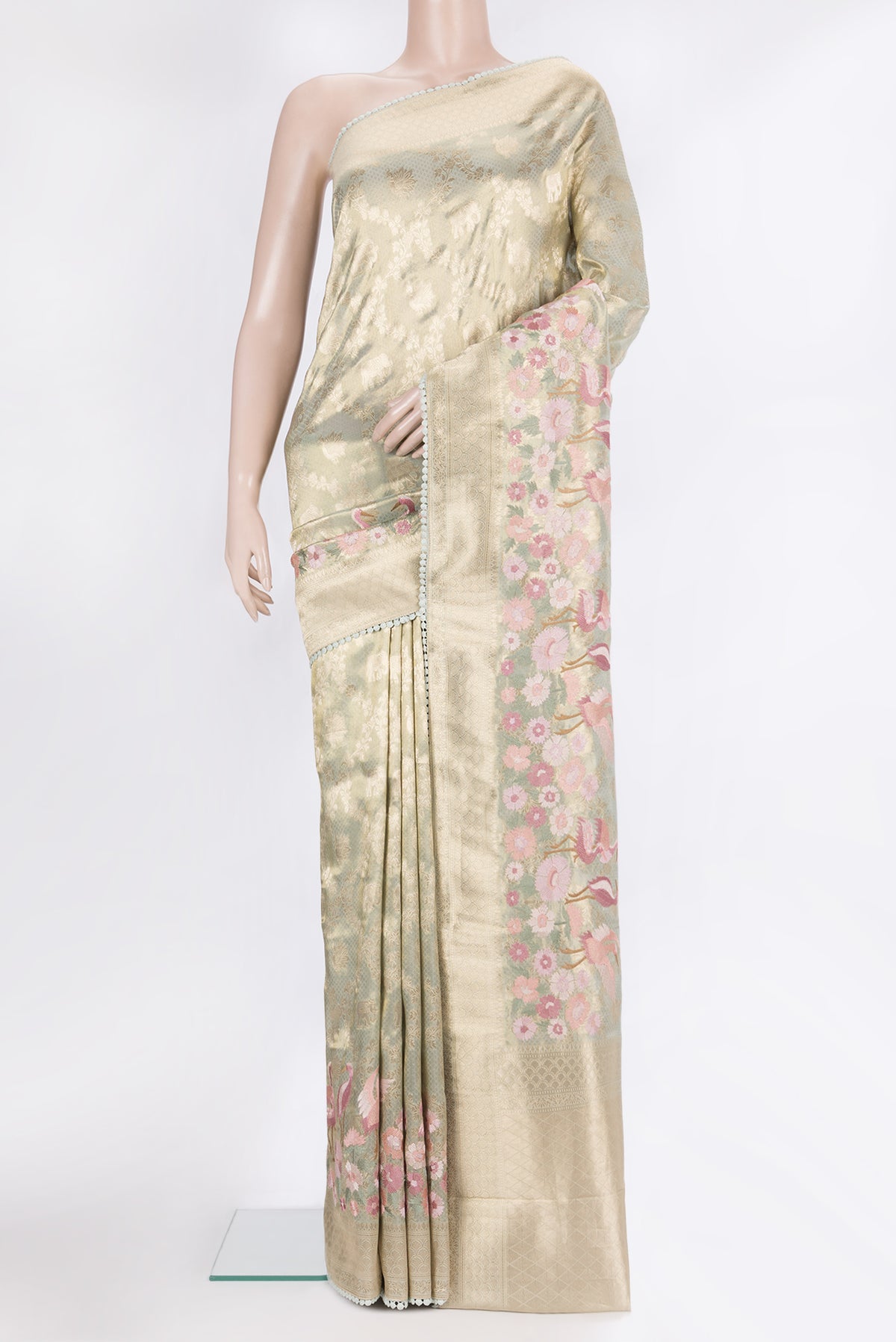Pista Green Blended Banarasi Silk Saree with Zari Brocade on the body and Fancy Border.  displayed on a mannequin