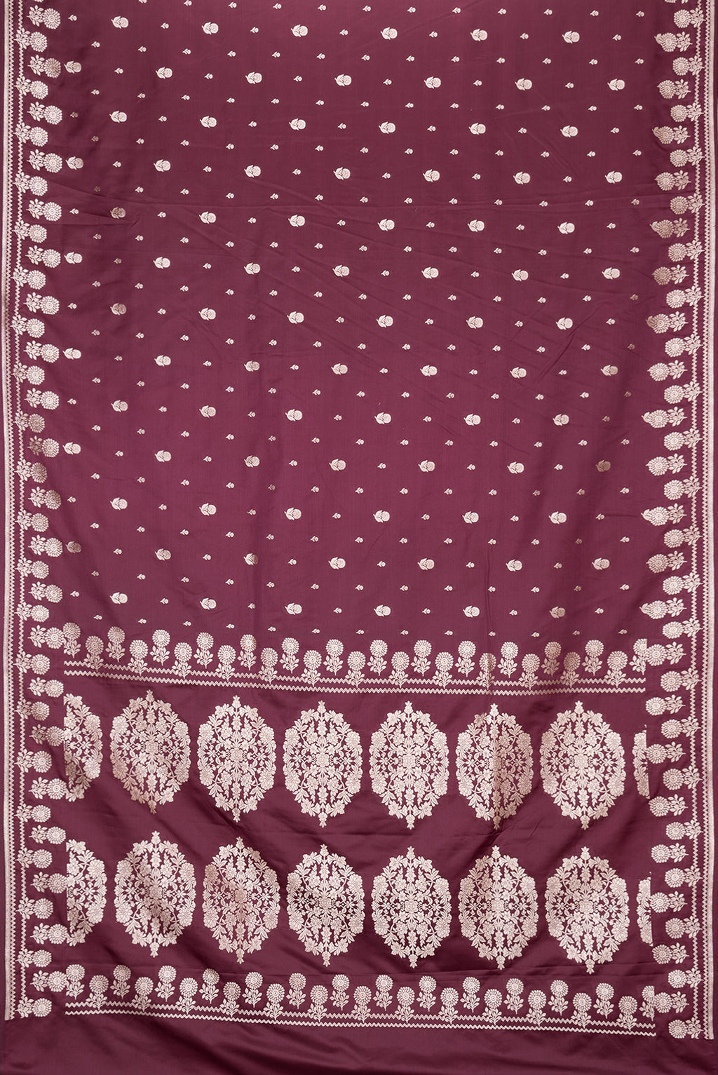 Flat view of Burgundy Dual Tone Banarasi Silk Saree with Zari Butta on the body and Zari Border. 