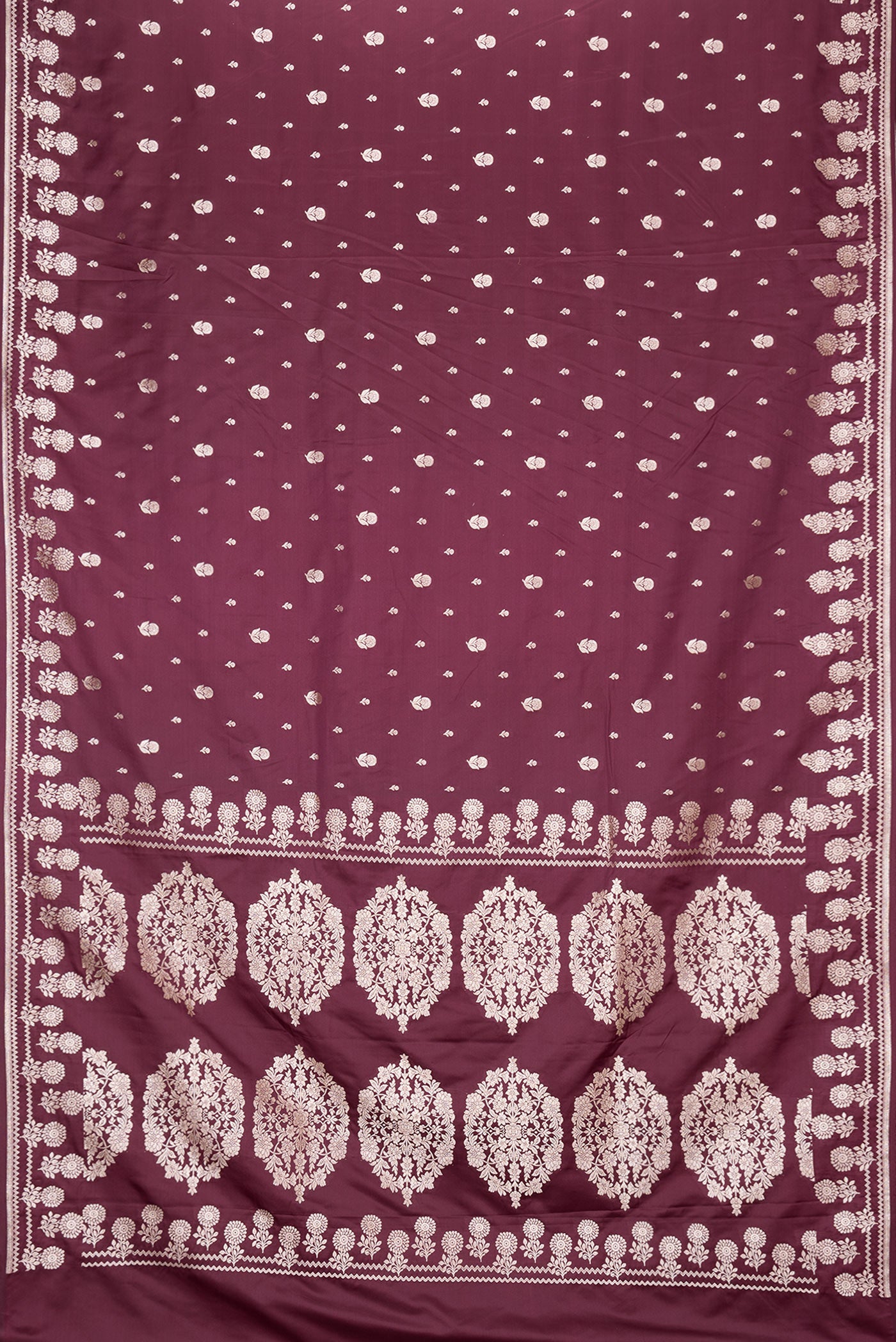 Flat view of Burgundy Dual Tone Banarasi Silk Saree with Zari Butta on the body and Zari Border. 