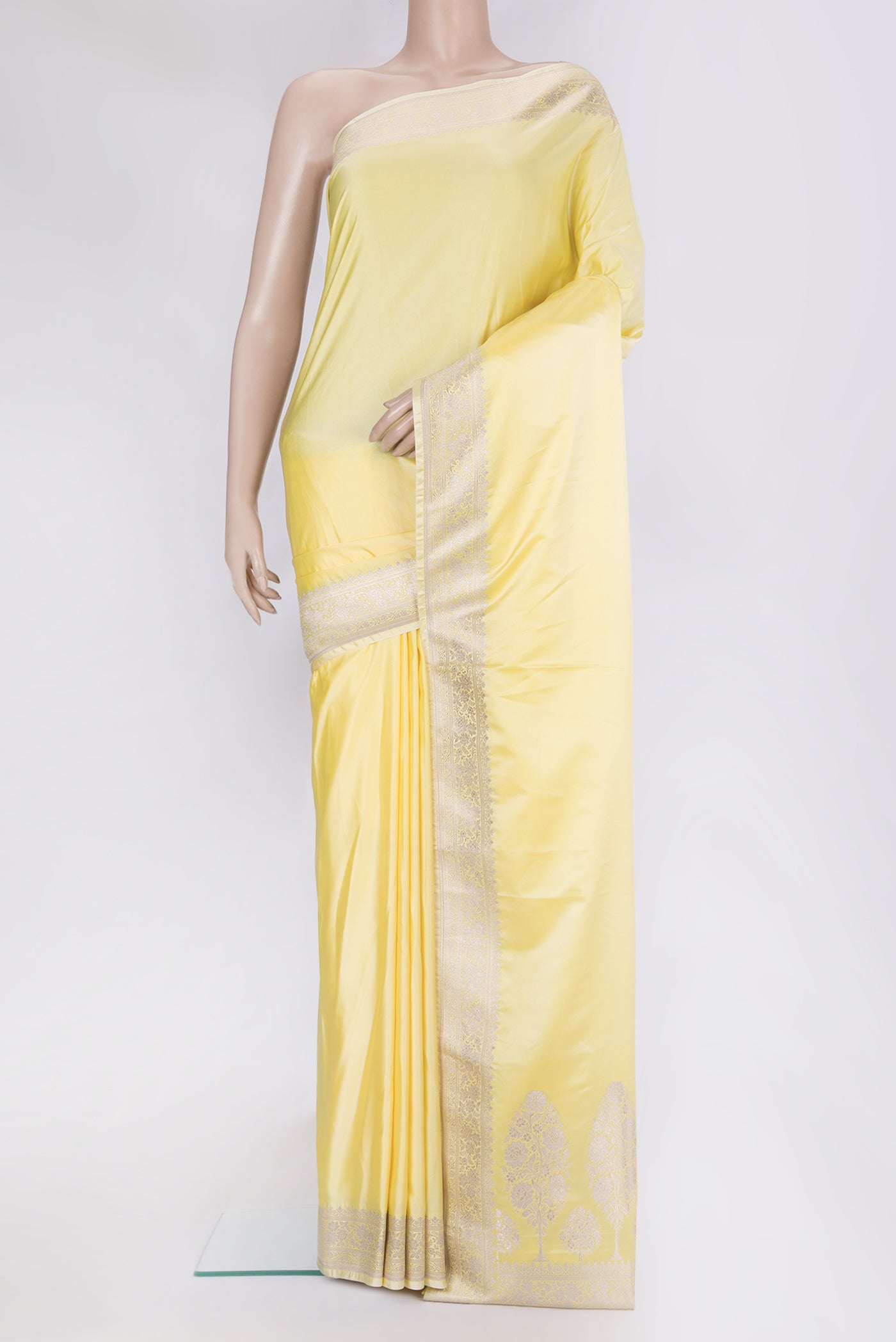 Lemon Yellow Blended Banarasi Silk Saree with Plain Body and Fancy Border.  displayed on a mannequin