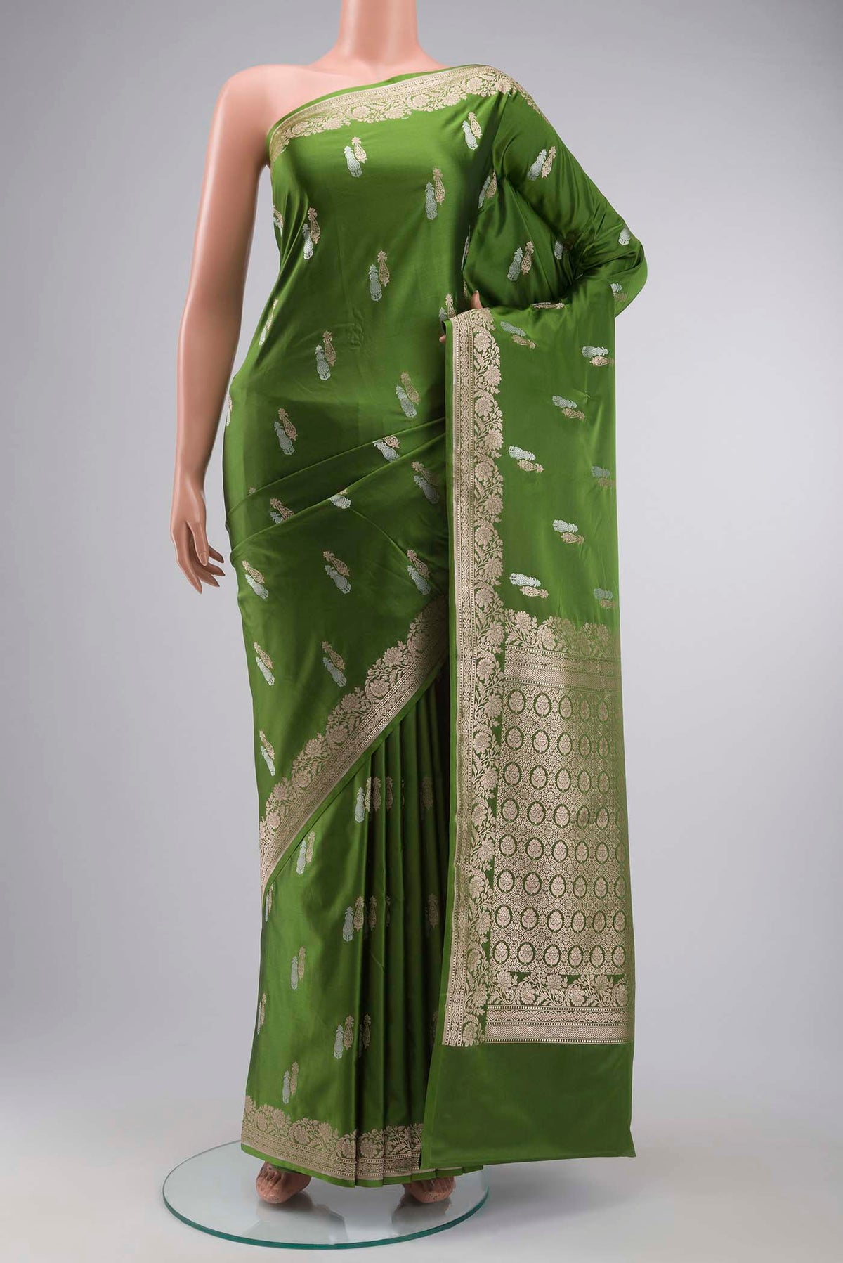 Green Blended Banarasi Silk Saree with Zari Butta on the body and Zari Border displayed on a mannequin