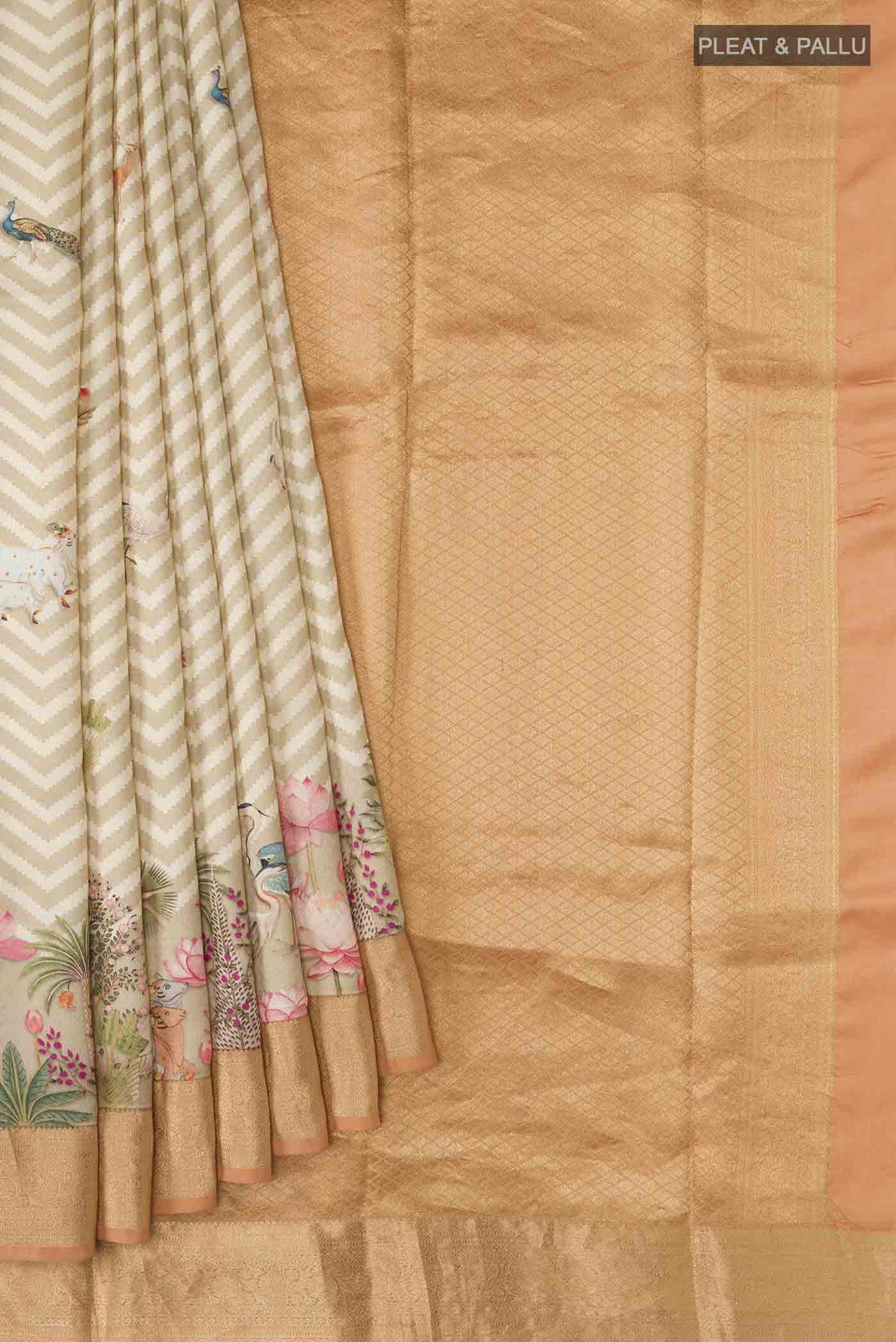 Pleats and pallu of Beige Printed Silk Saree with Printed design on the body and Zari Border