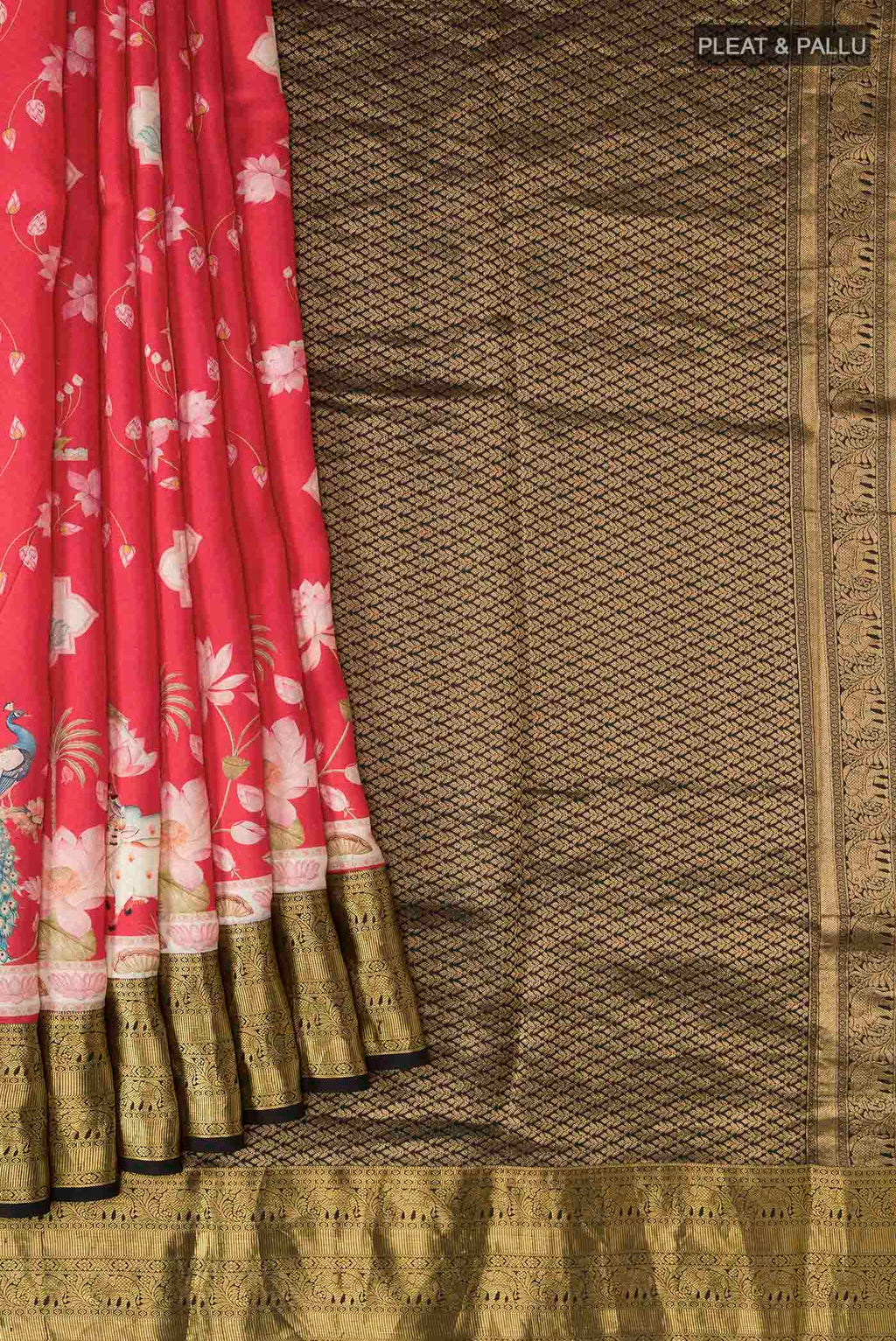 Pleats and pallu of Red Printed Silk Saree with Printed design on the body and Zari Border