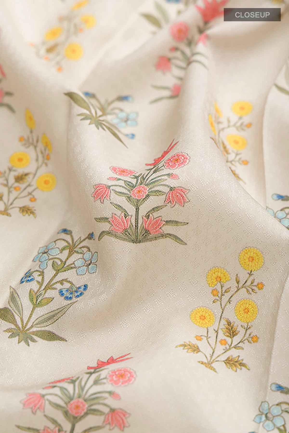 Close up of Green Printed Silk Saree with Printed design on the body and Thread Border displaying folds