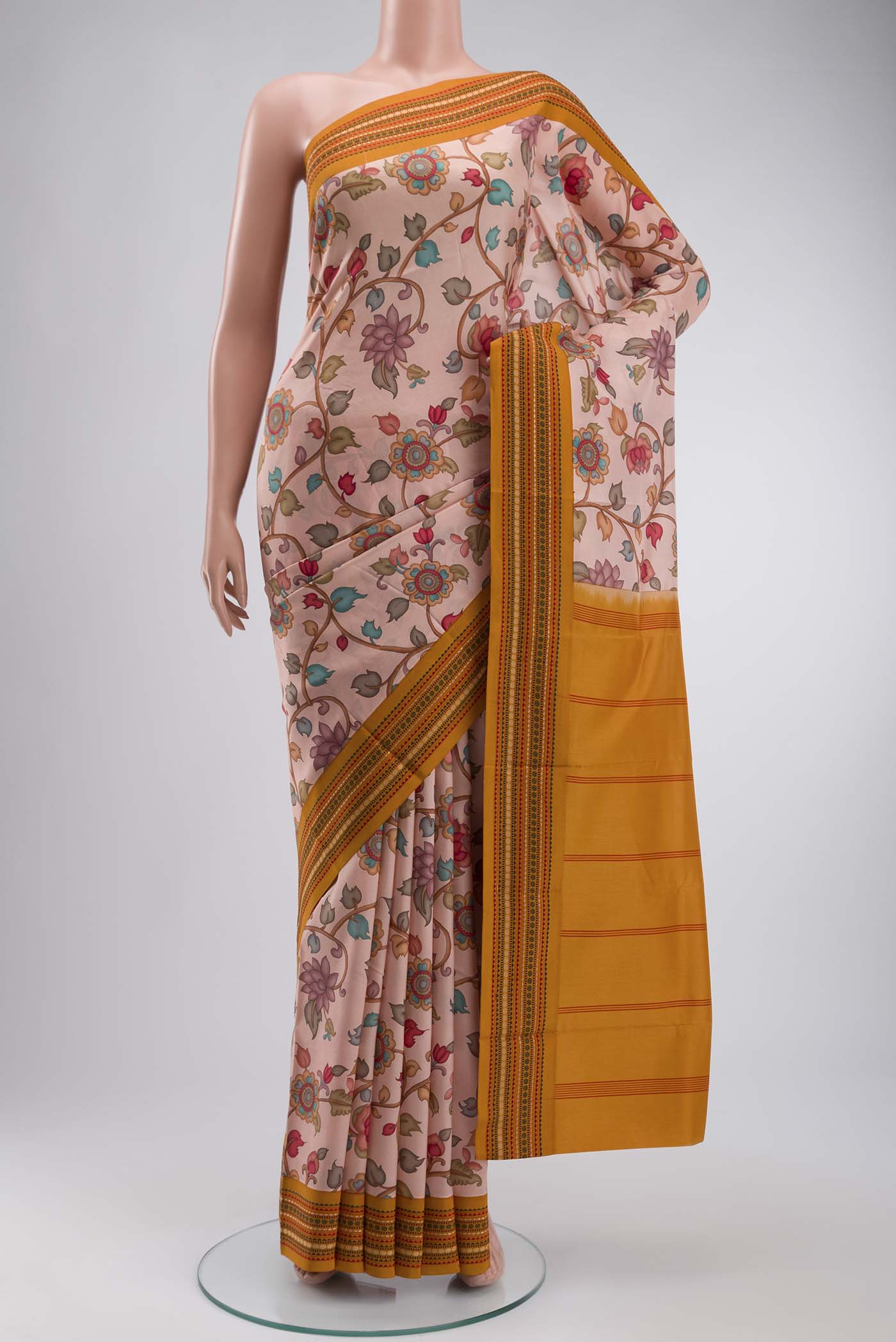 Rose pink Printed Silk Saree with Printed design on the body and Thread Border displayed on a mannequin