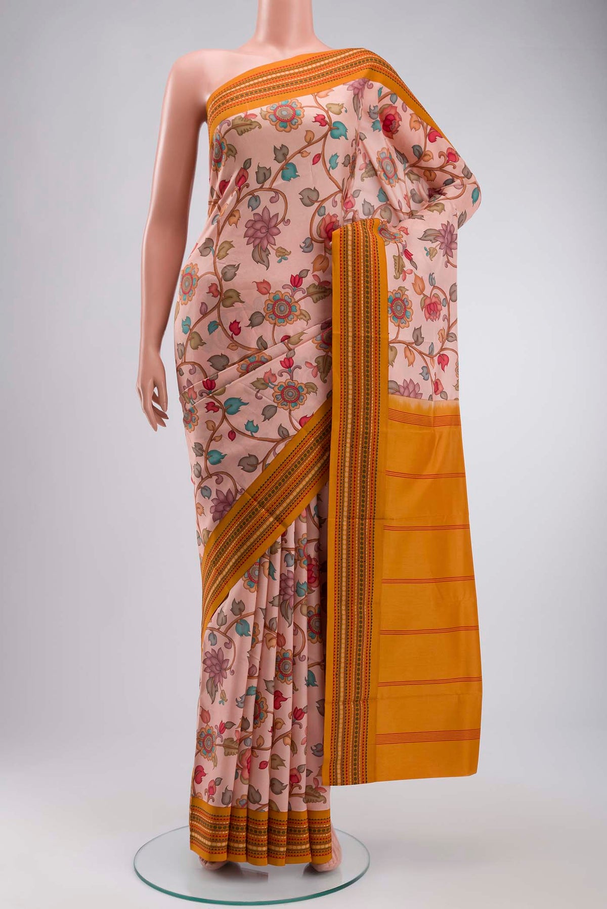 Rose pink Printed Silk Saree with Printed design on the body and Thread Border displayed on a mannequin