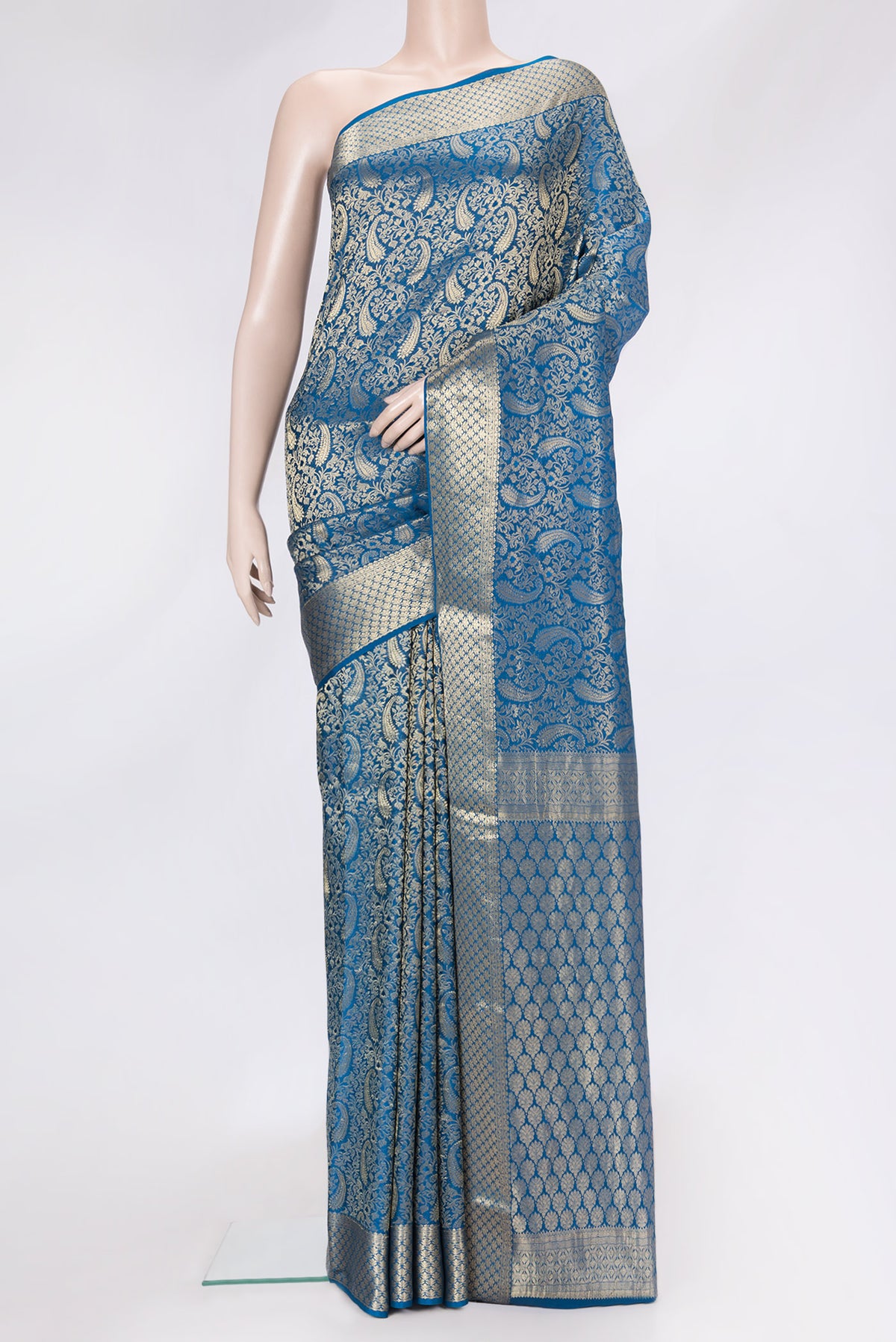 Peacock Blue Dual Tone Mysore Silk Saree with Zari Brocade on the body and Zari Border.  displayed on a mannequin