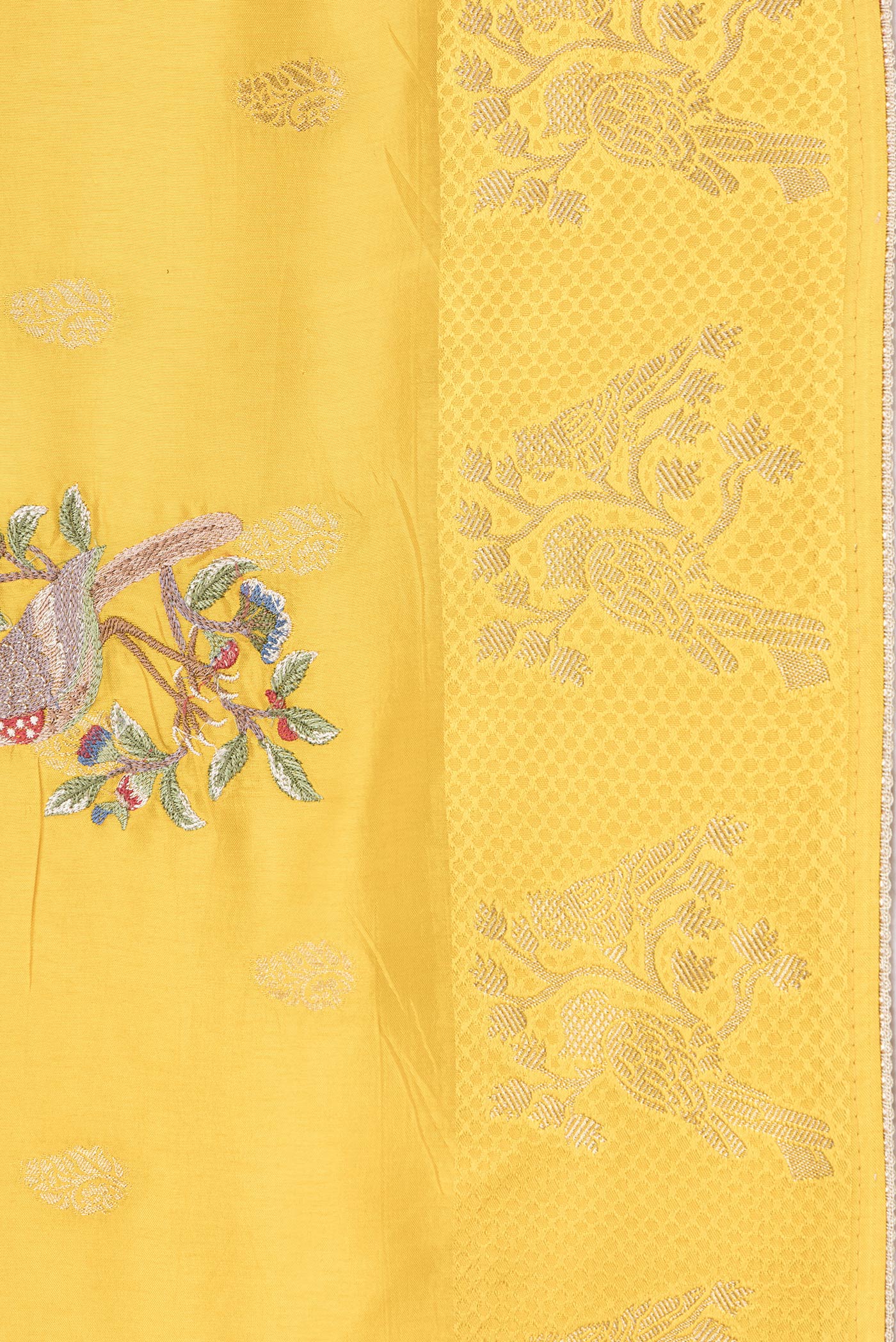 Border image of Yellow Dual Tone Tussar Silk Saree with Zari Butta on the body and Fancy Border. 