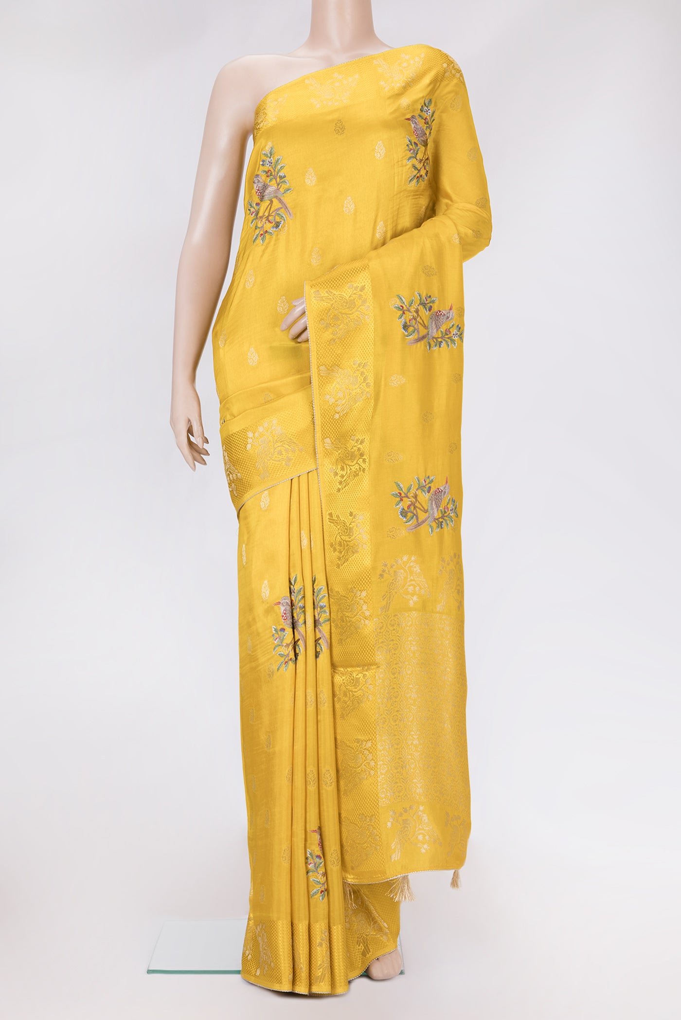 Yellow Dual Tone Tussar Silk Saree with Zari Butta on the body and Fancy Border.  displayed on a mannequin