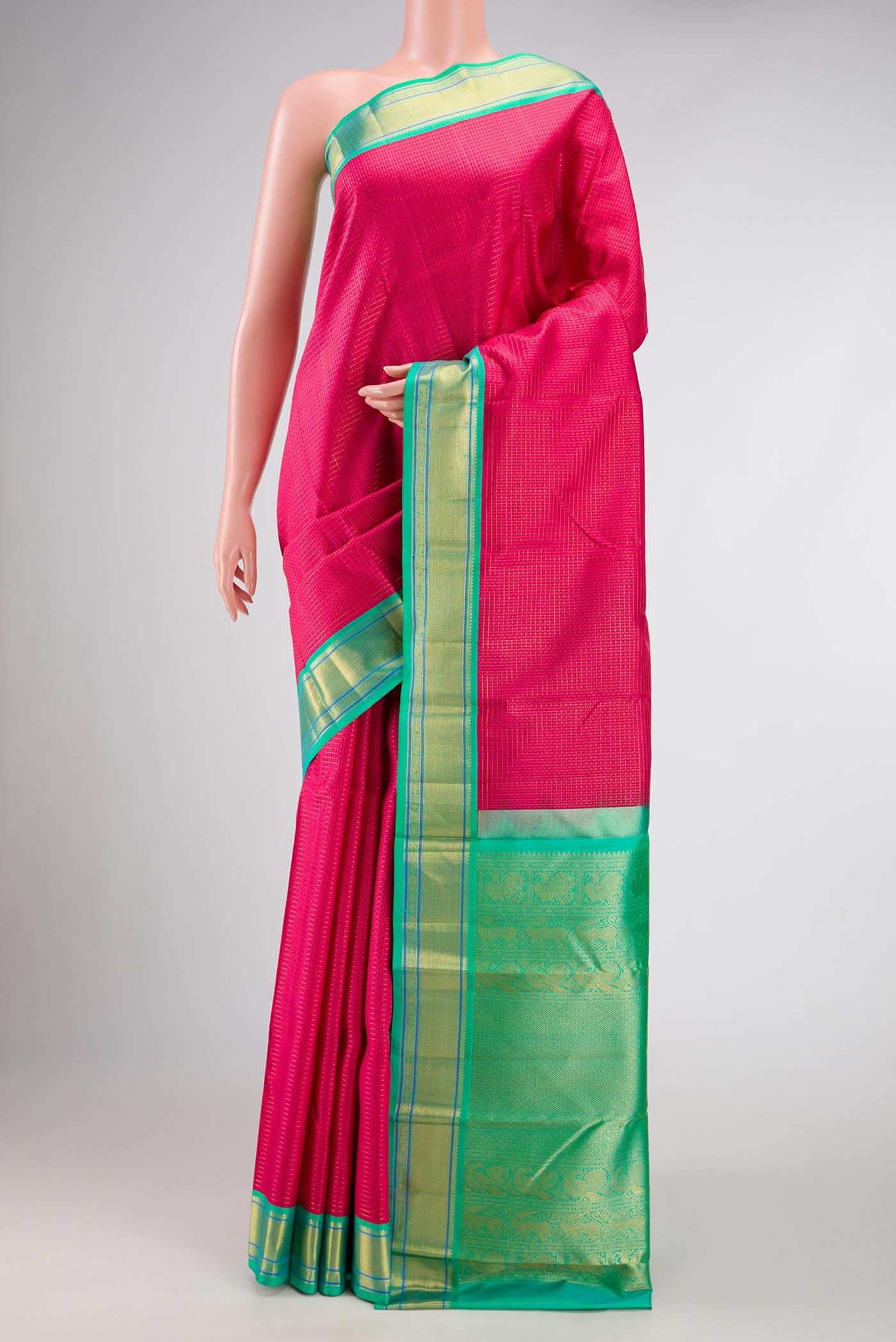 Dark Pink Dual Tone Kanjivaram Silk Saree with Jacquard design on the body and Zari Border.  displayed on a mannequin