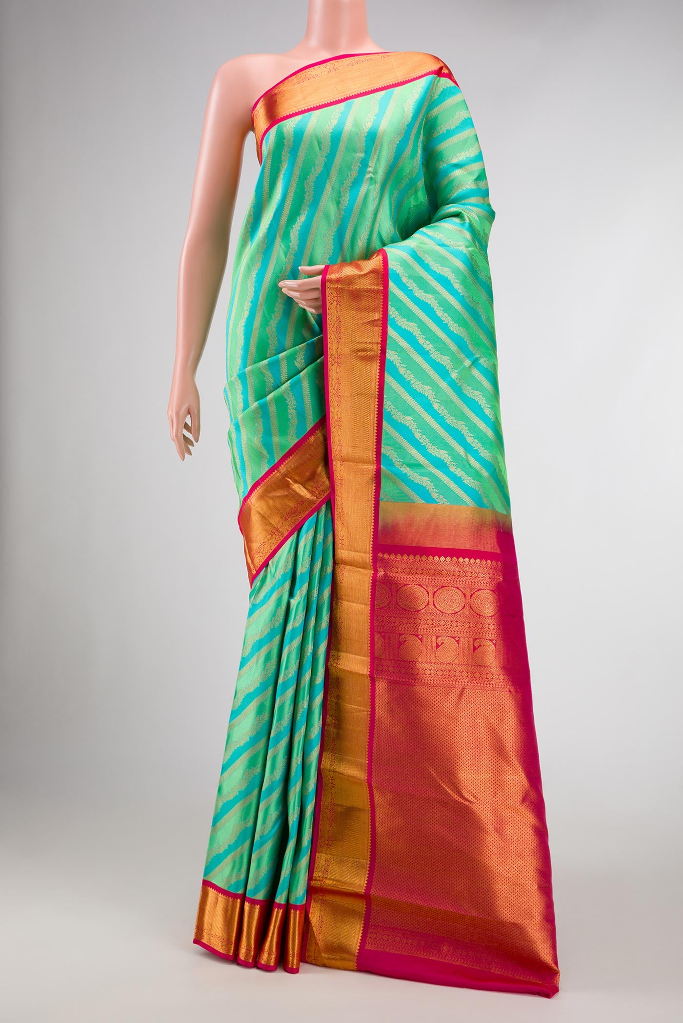 Pista Green and Sky Blue Dual Tone Kanjivaram Silk Saree with Zari Brocade on the body and Zari Border.  displayed on a mannequin