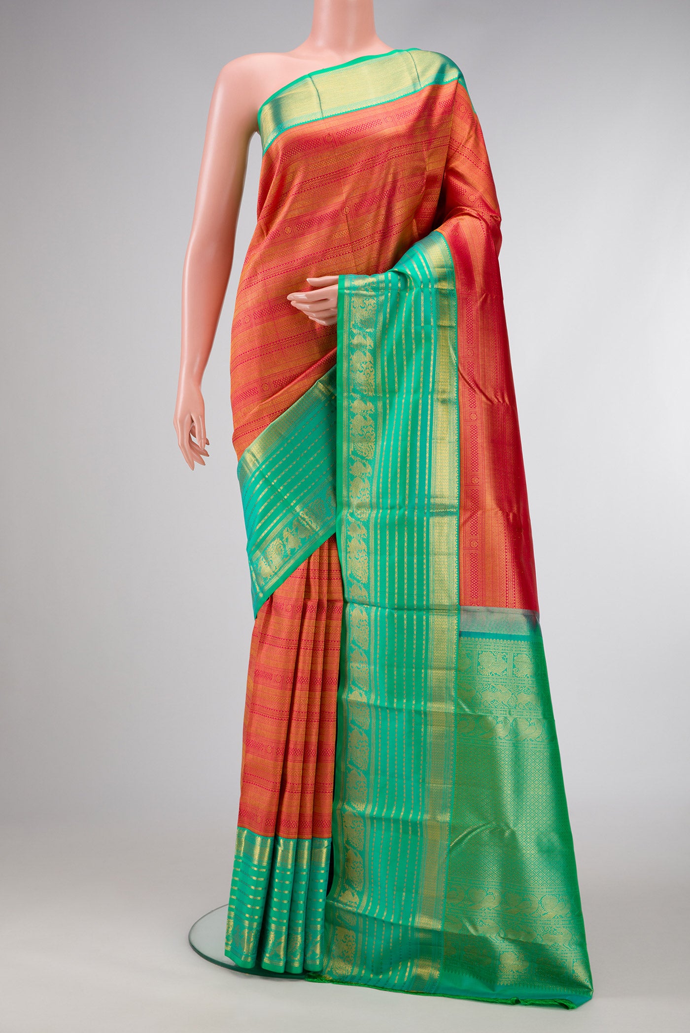 Pink Dual Tone Kanjivaram Silk Saree with Zari Brocade on the body and Fancy Border.  displayed on a mannequin